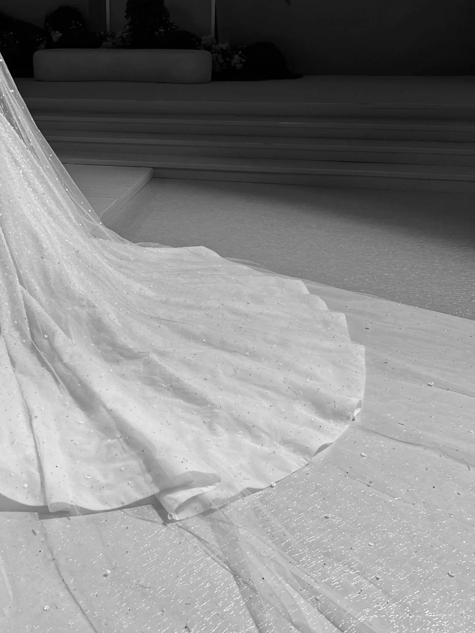 A wedding dress with a long train, wedding content creator dubai, wedding content UAE, wedding photography and videography, destination wedding content creation, best wedding content creator dubai, wedding content creation expat