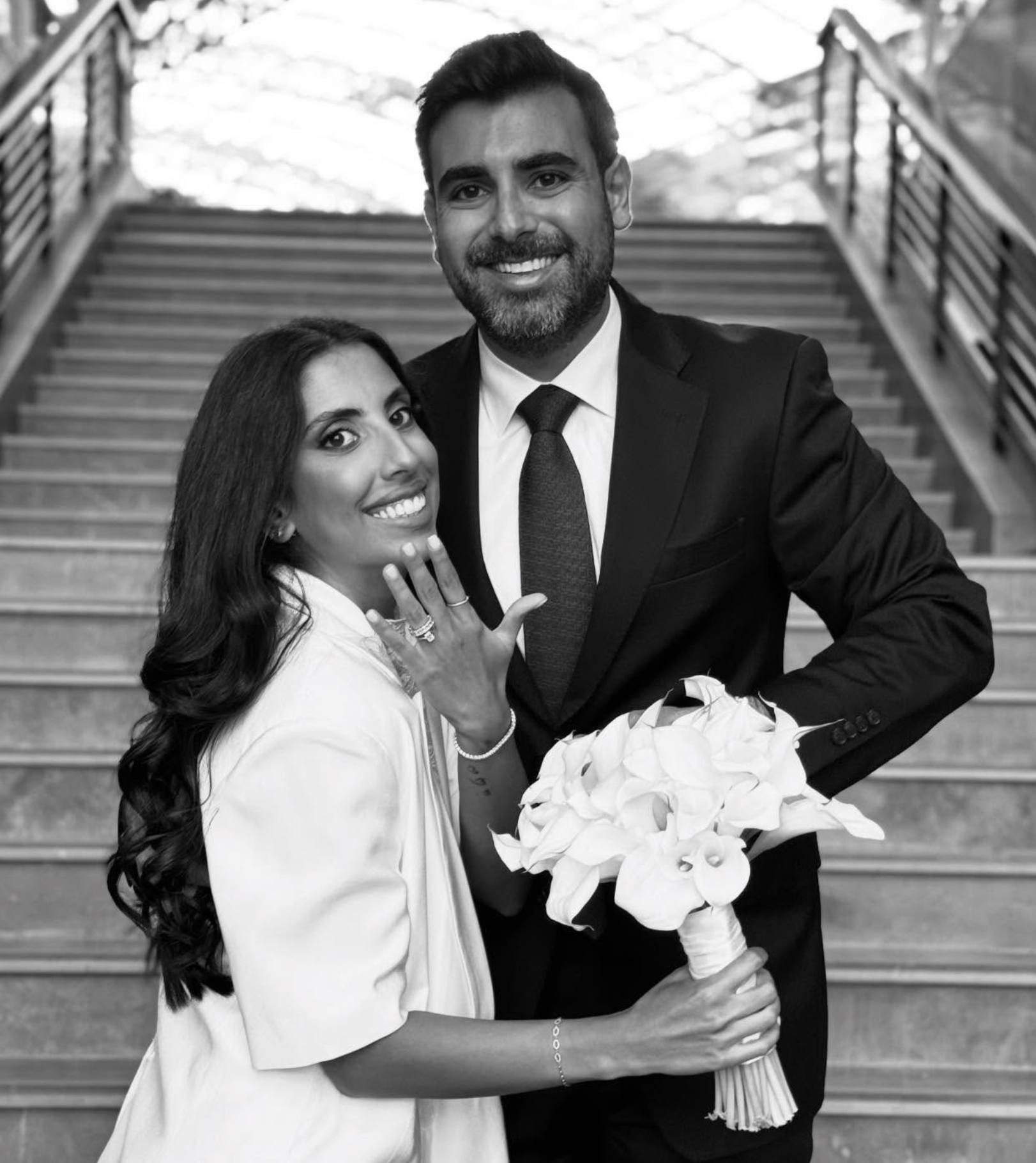A smiling couple, the woman showing her engagement ring, wedding content creator dubai, wedding content UAE, wedding photography and videography, best wedding content creator dubai, wedding content creation expat