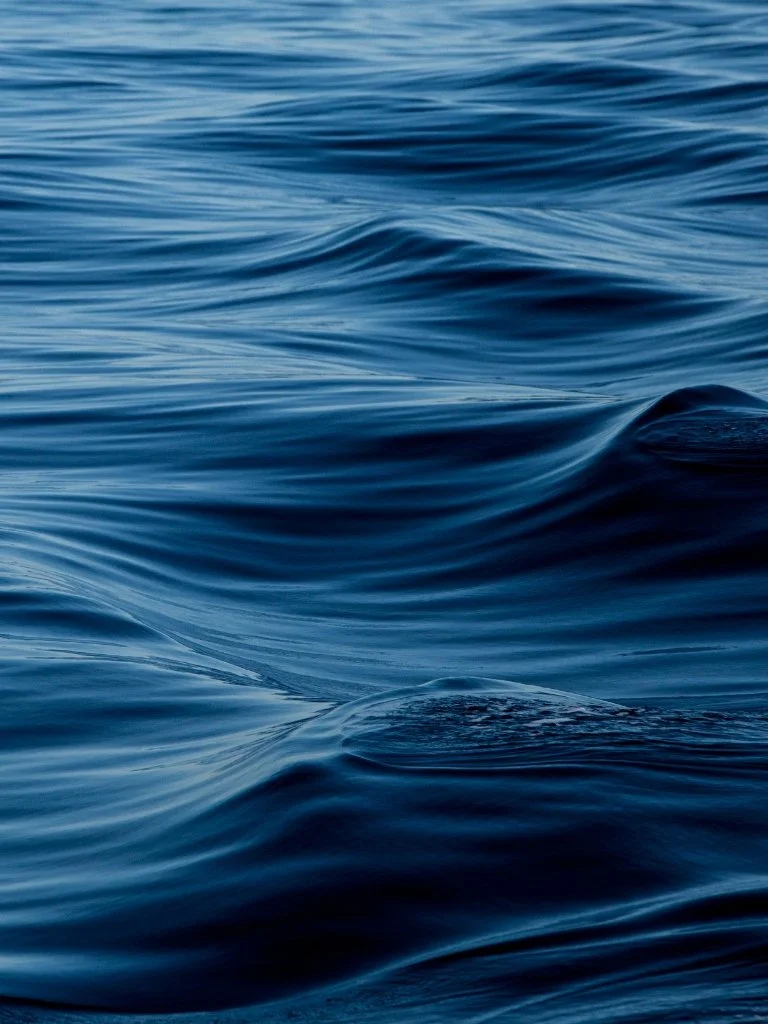 Close-up of calm blue ocean water with gentle ripples.