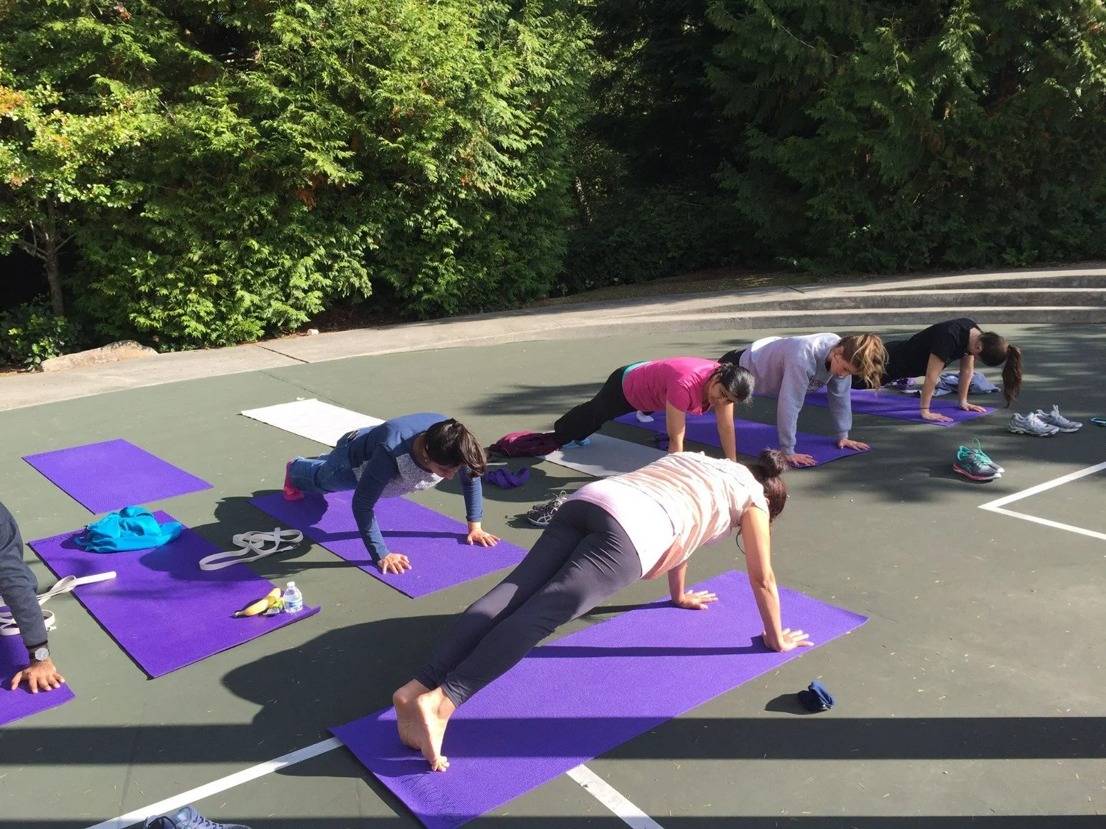 Anu teaching a small class yoga