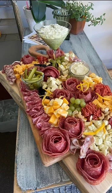 Wattle & Daub charcuterie board with meat, cheese, fruit, vegetable and dips