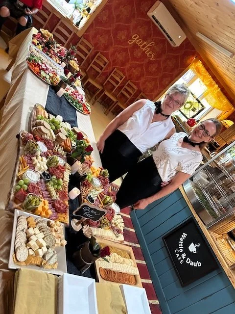 Wattle & Daub Event Space with table full of food