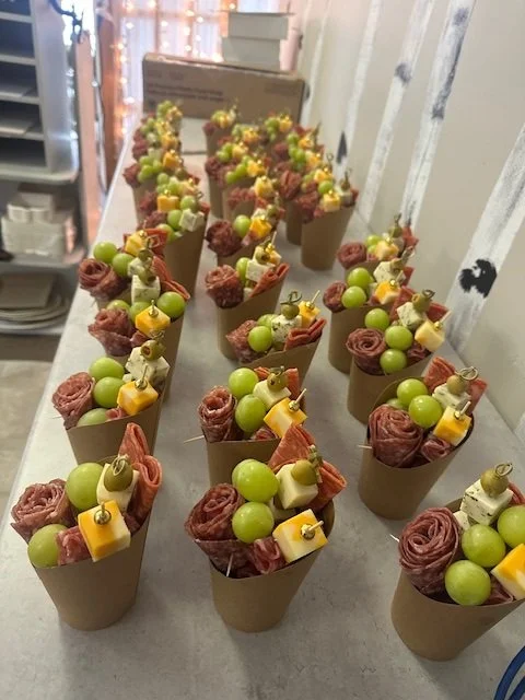 Wattle & Daub charcuterie cups all lined up on a table