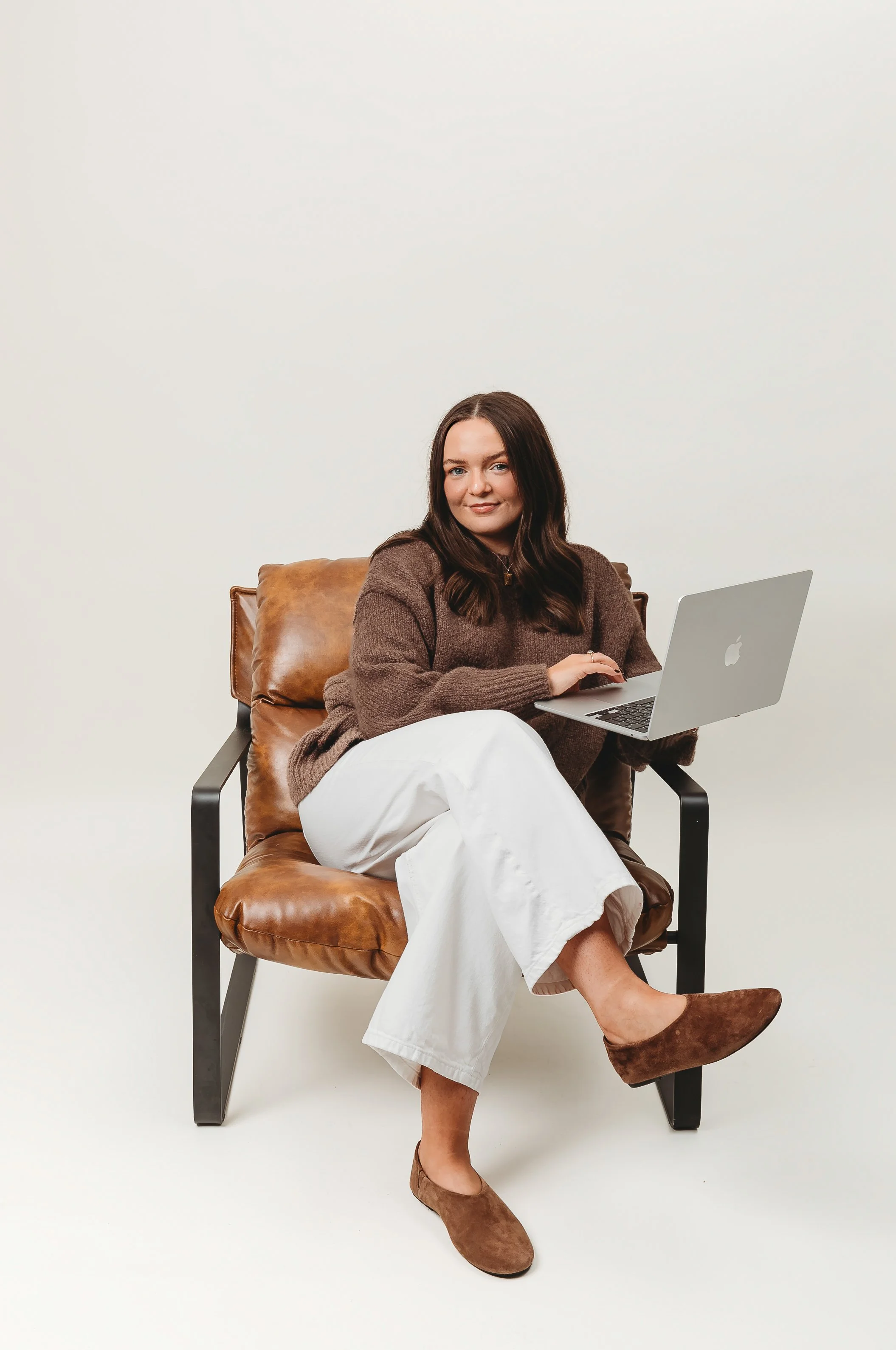 Social media marketing team creating engaging content on laptops and phones UGC agency