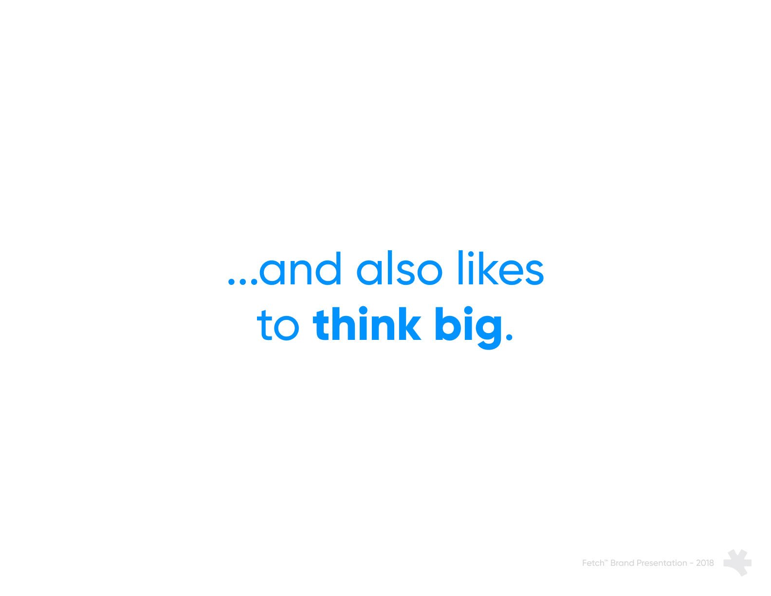 Presentation slide with blue text saying '...and also likes to think big.' on a white background.