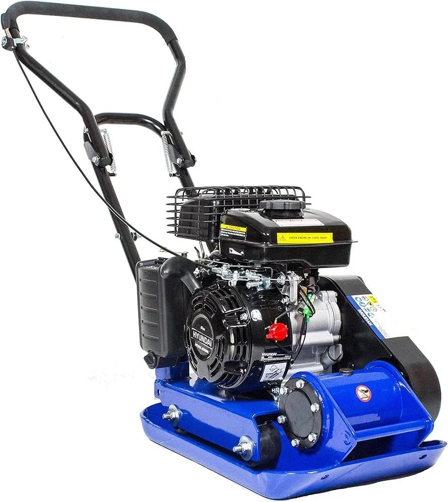 A blue and black gasoline-powered plate compactor with a Honda engine and a handle for pushing. wacker plate hire. chepstow, newport, usk, caldicot
