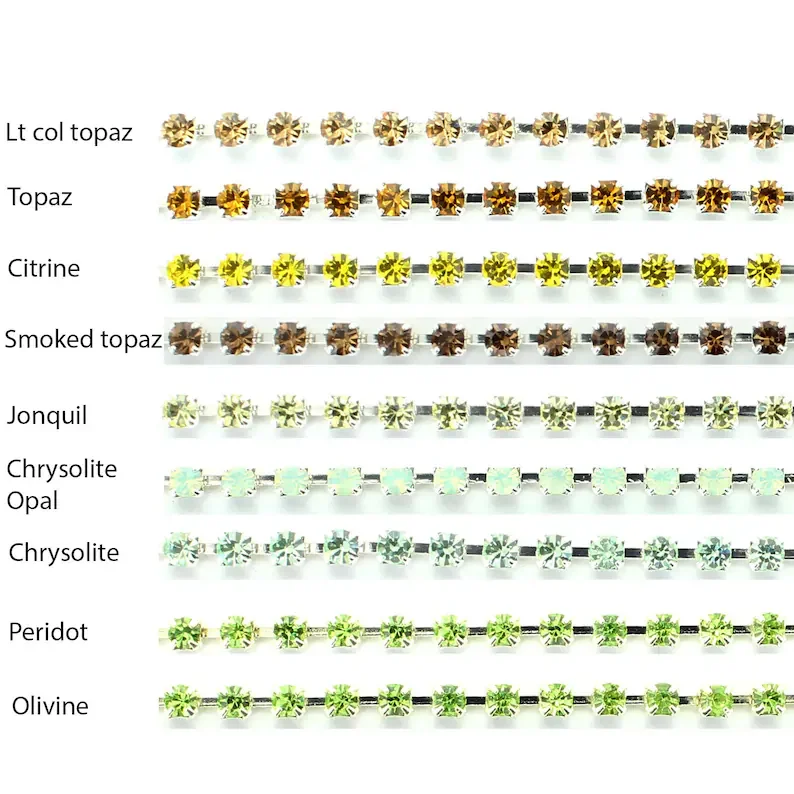 A chart displaying various colors of gemstone or jewelry settings, each labeled with their specific color name, including light color topaz, topaz, citrine, smoked topaz, jonquil, chrysolite opal, chrysolite, peridot, and olivine.