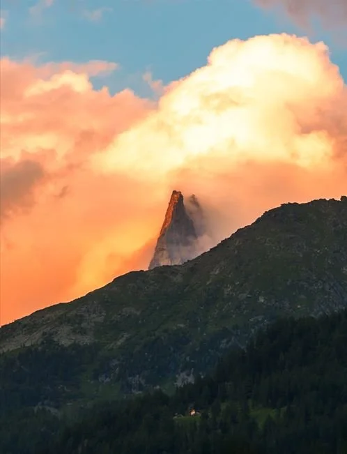 The Alps nestled in the colorful clouds of a French sunset - Chamonix, France