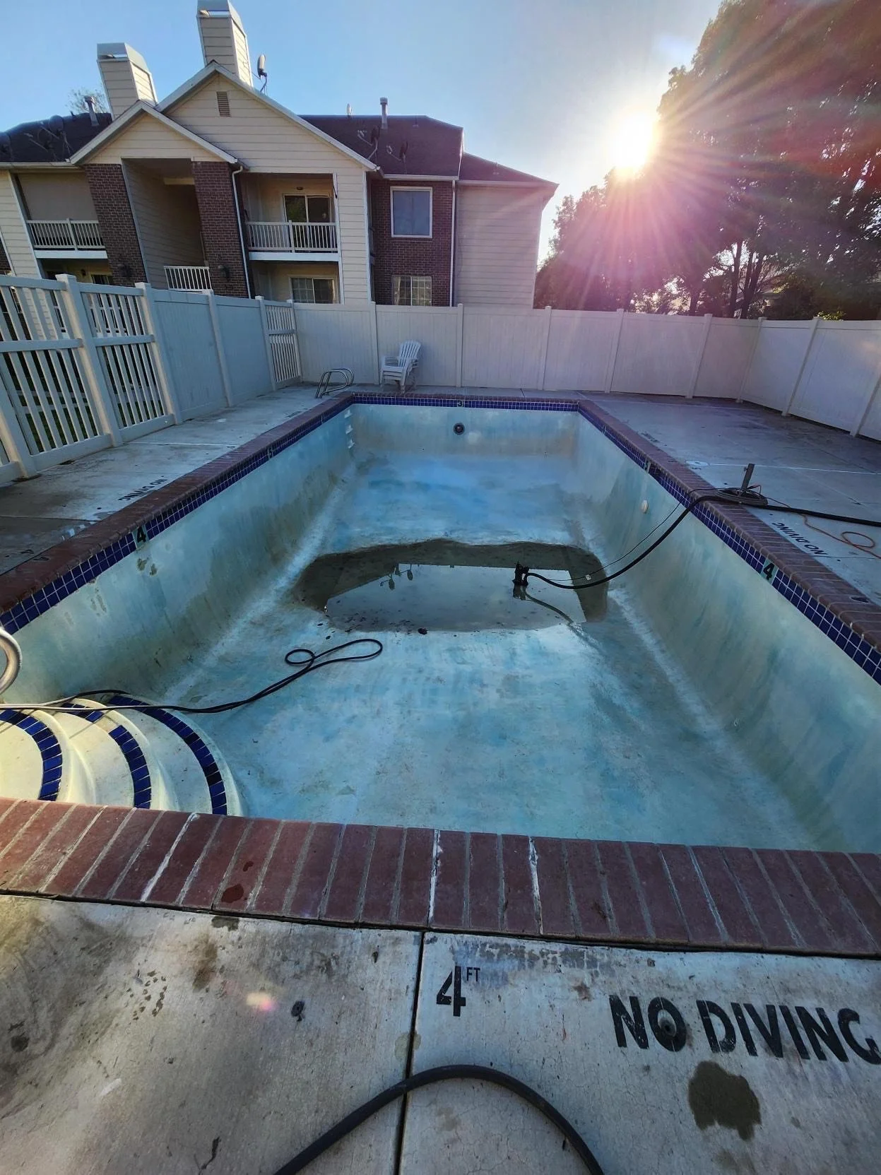Before picture of dirty water and debris in pool.