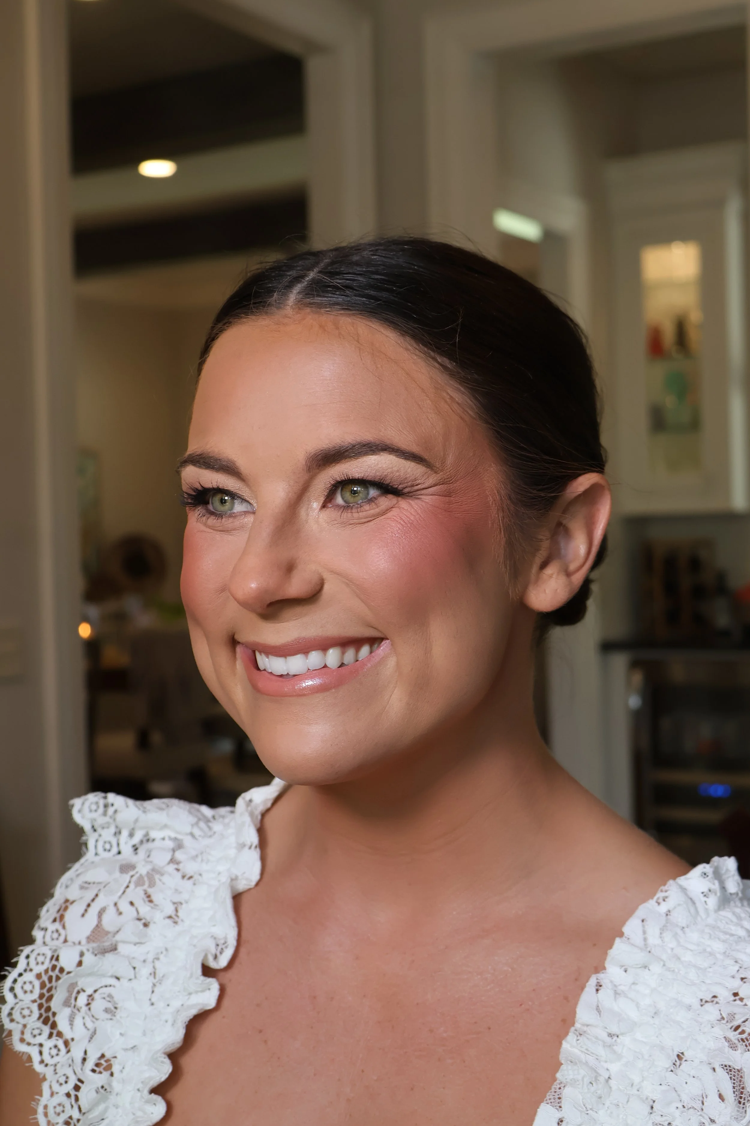 Bridal makeup artist enhancing natural beauty for luxury wedding photography