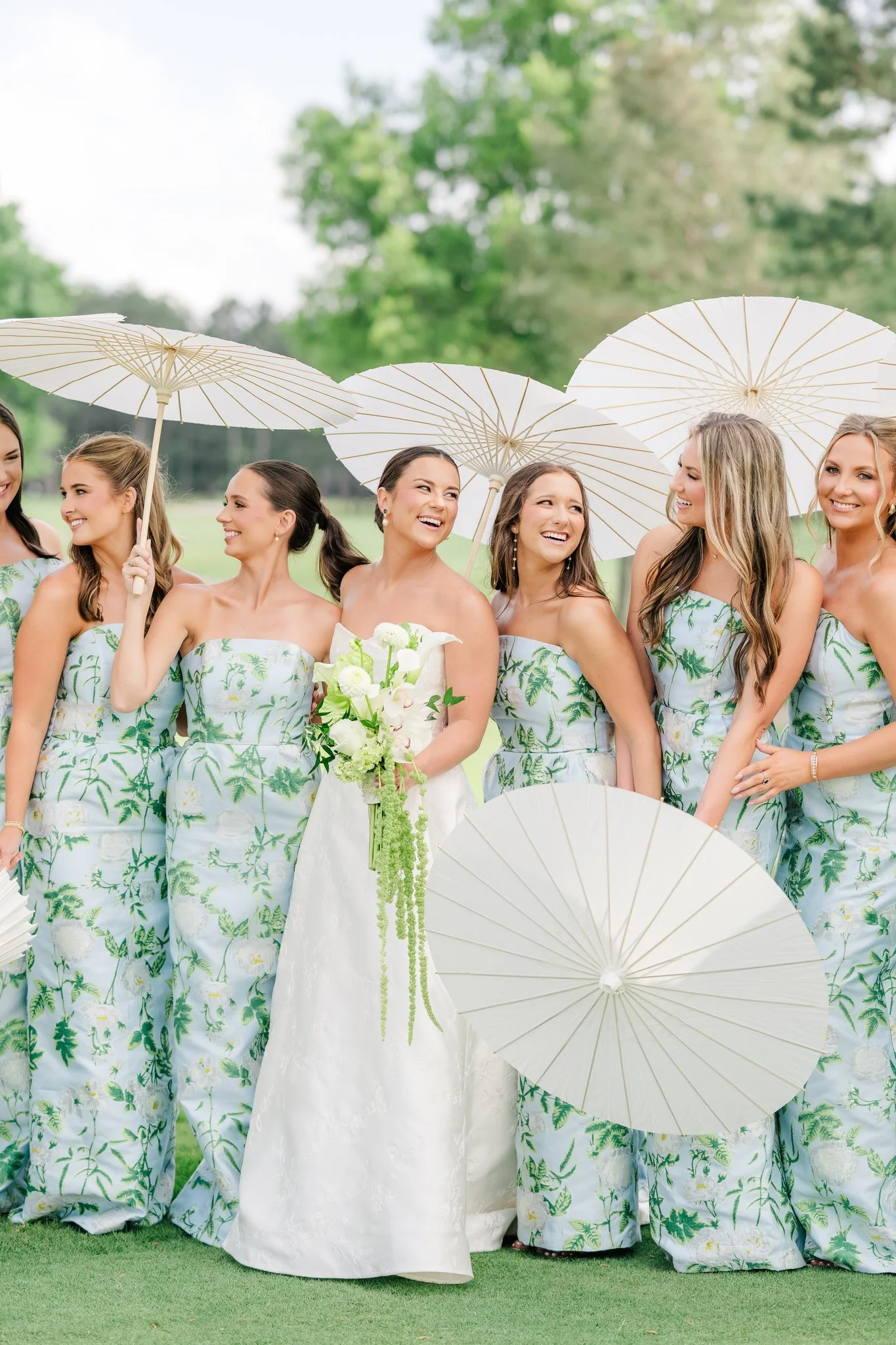 Bride and bridesmaids with coordinated soft glam hair and makeup styles