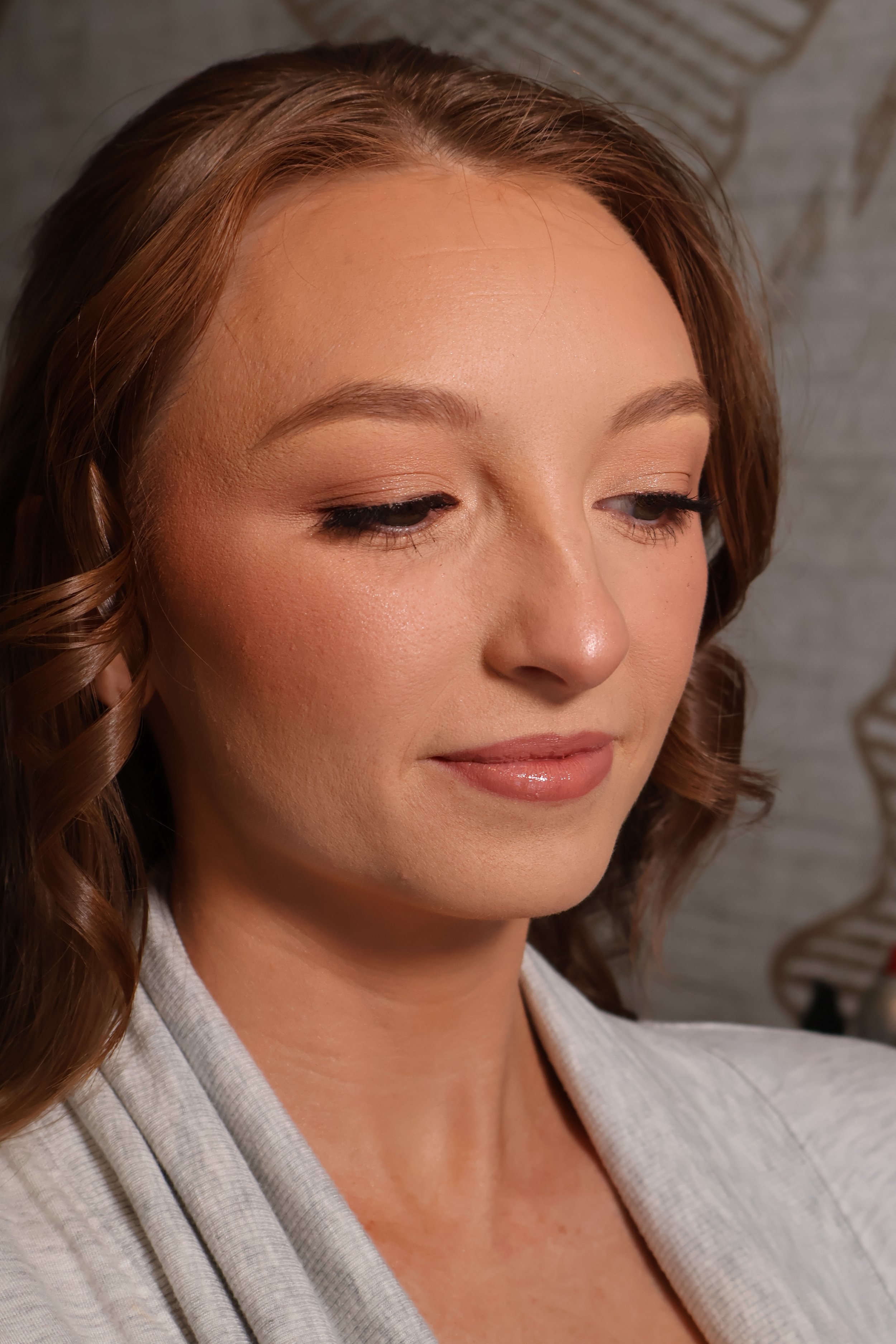 Soft glam makeup for engagement pictures with natural lashes and glowing finish