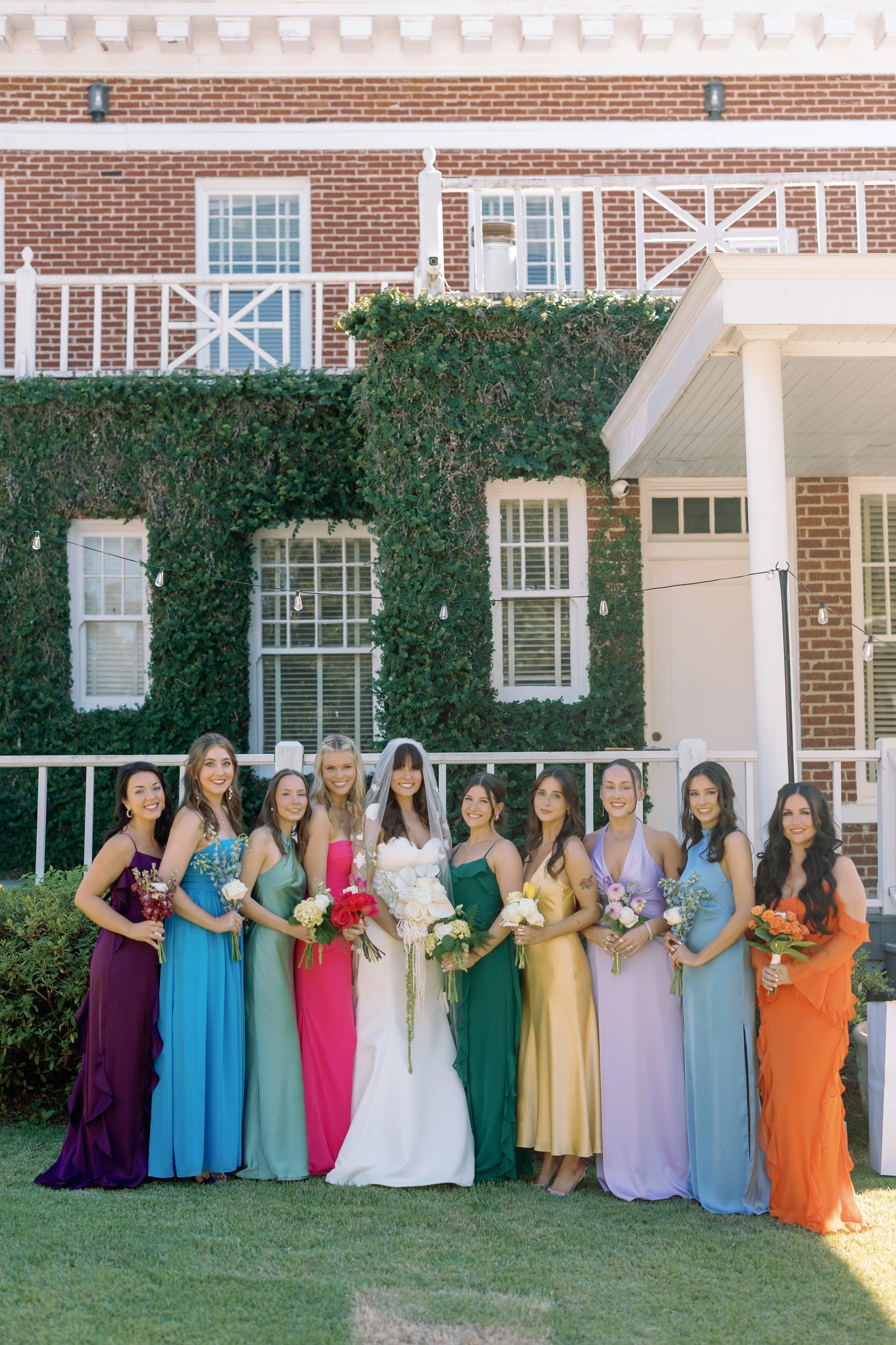 Bridesmaids in matching getting ready outfits with hair and makeup by Golden Girls Glam