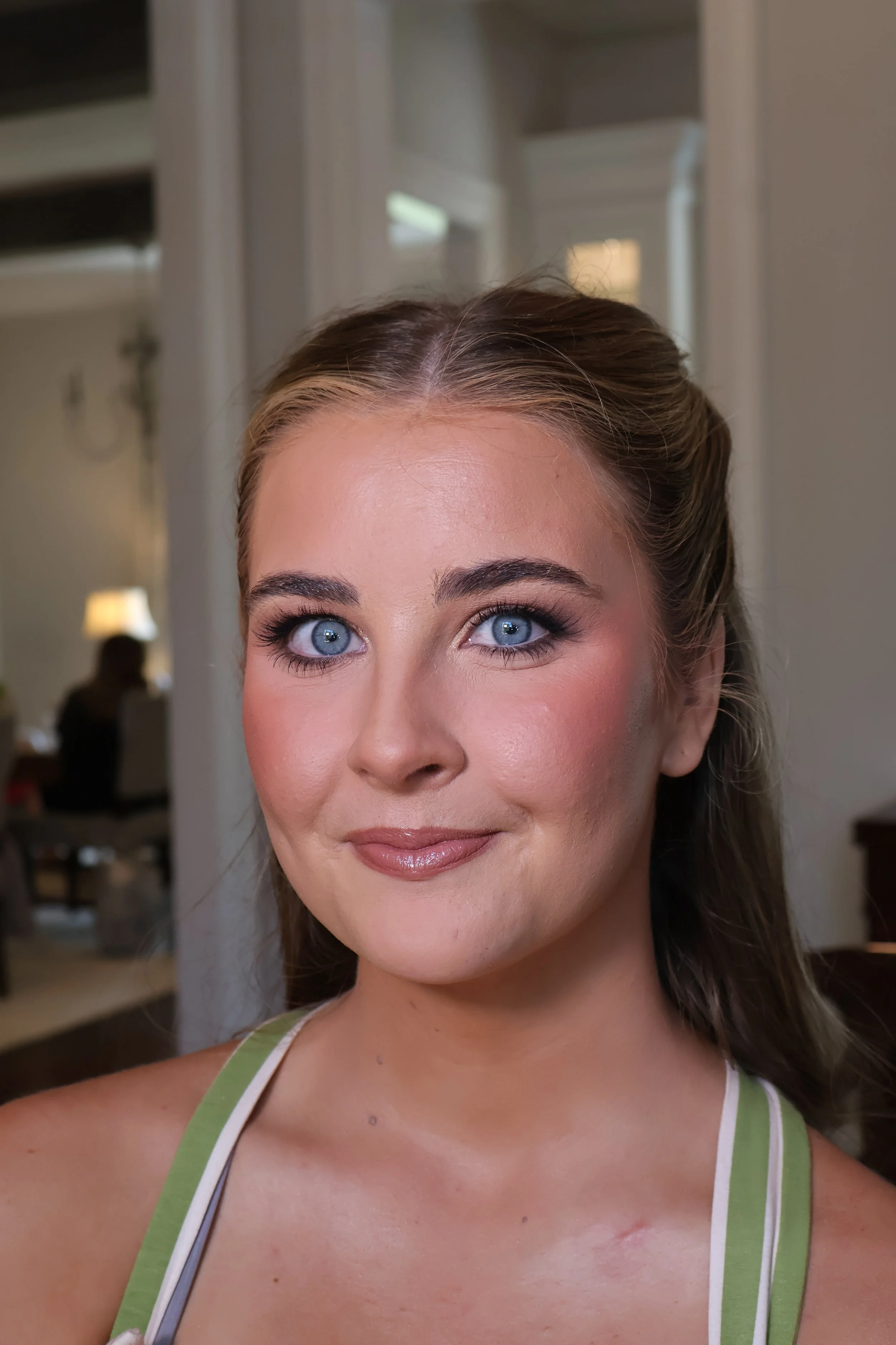 Elegant bridal portrait featuring soft glam makeup and classic wedding updo