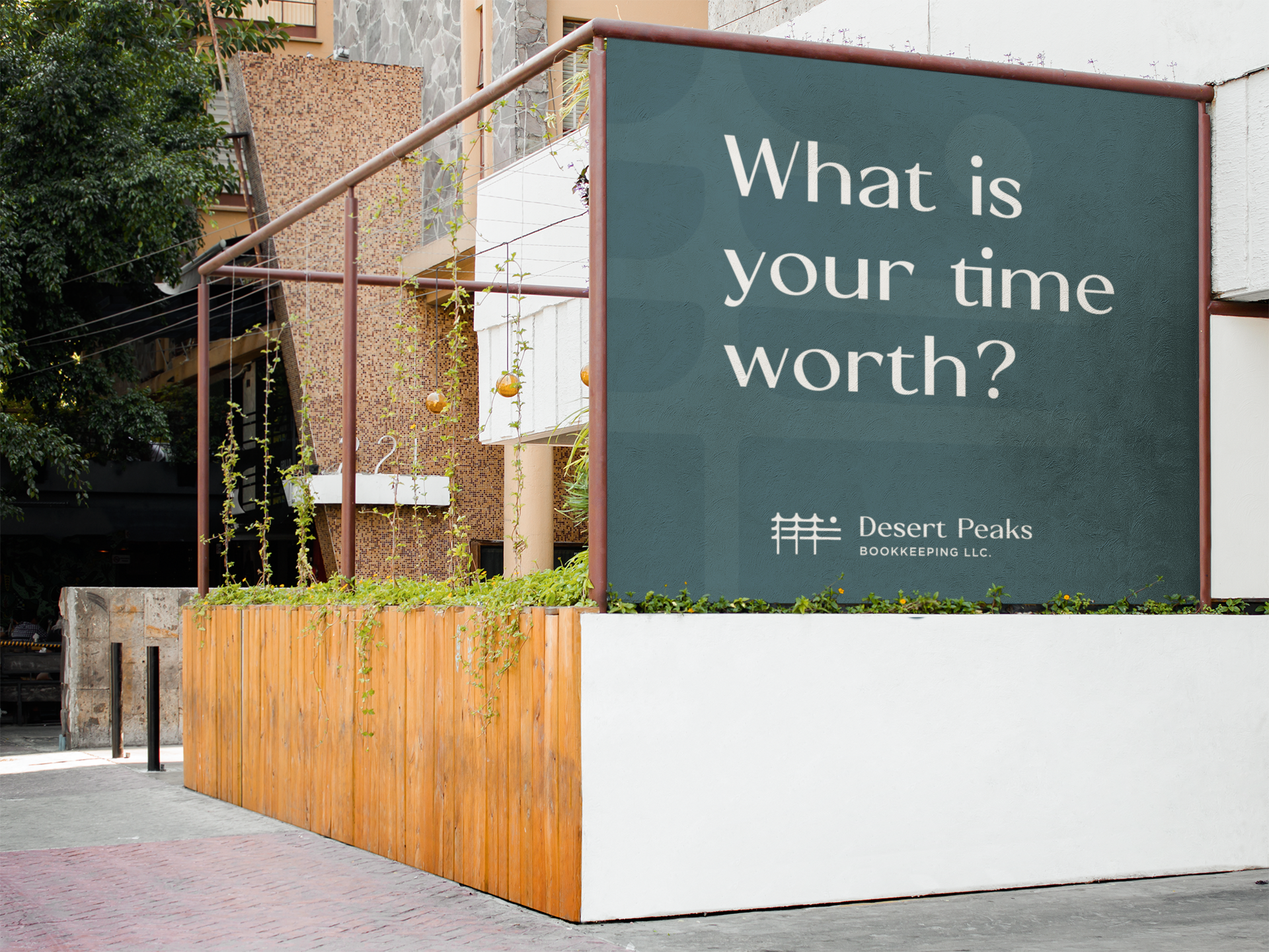 A large outdoor sign with the text "What is your time worth?" and the logo for Desert Peaks Bookkeeping LLC, situated next to a wooden fence and a building with a stone and beige exterior.