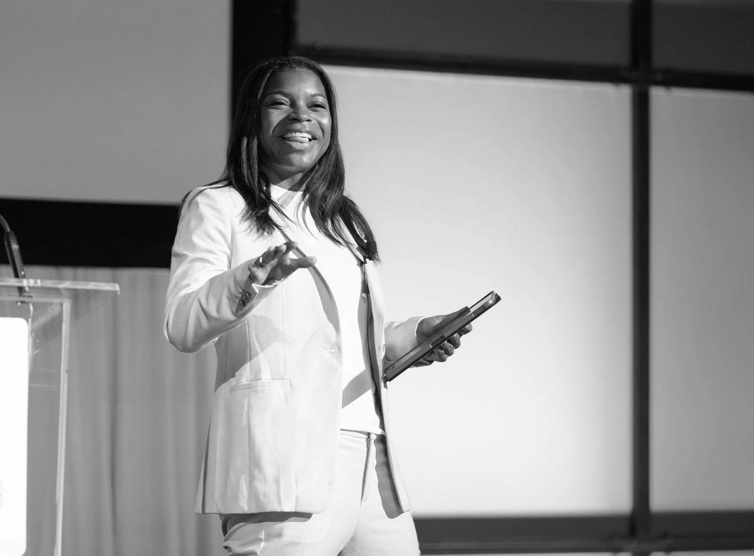Courtney Davis keynote speaker presenting at a professional conference.