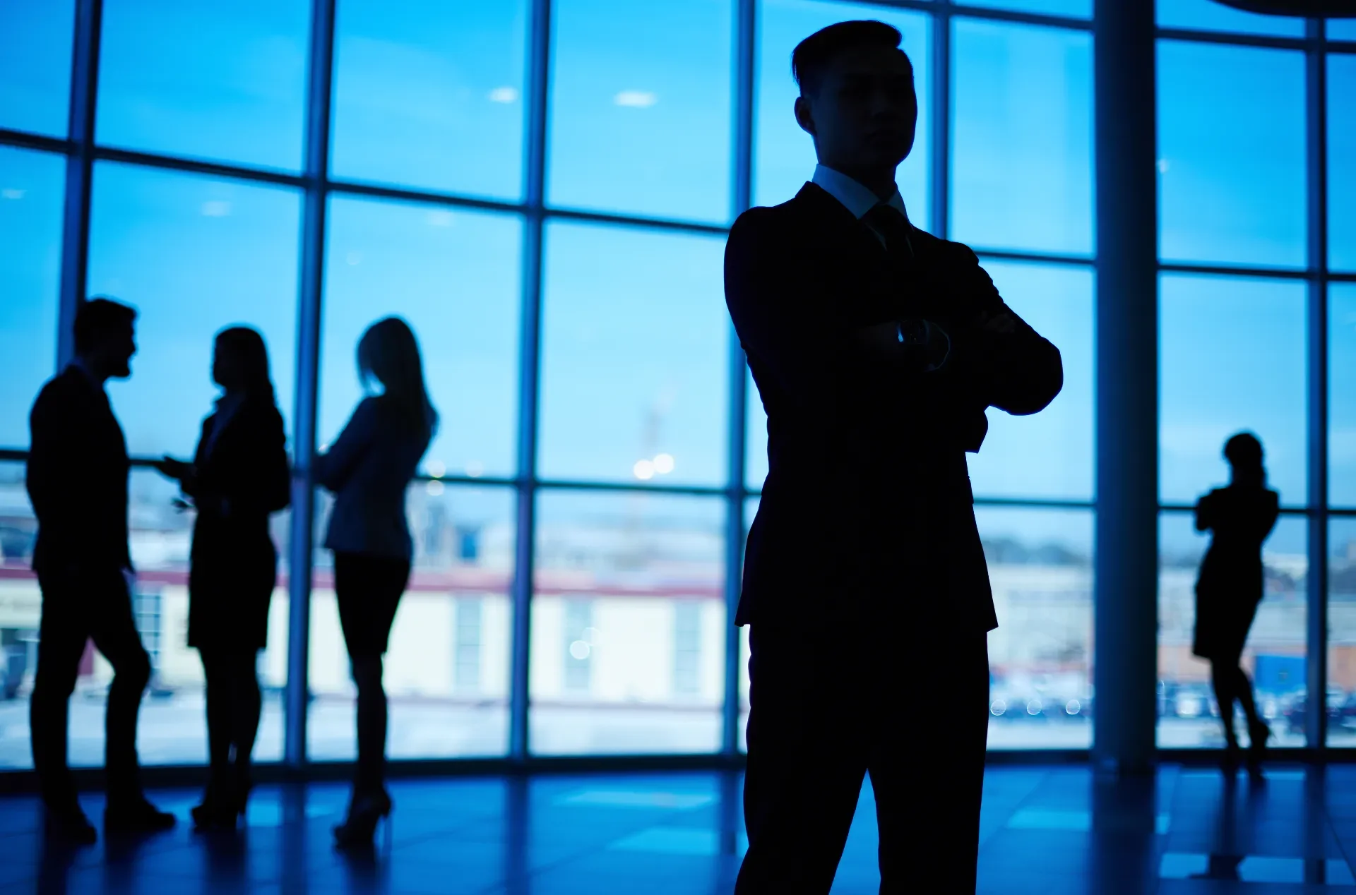 Professionals gathered in a modern corporate environment.