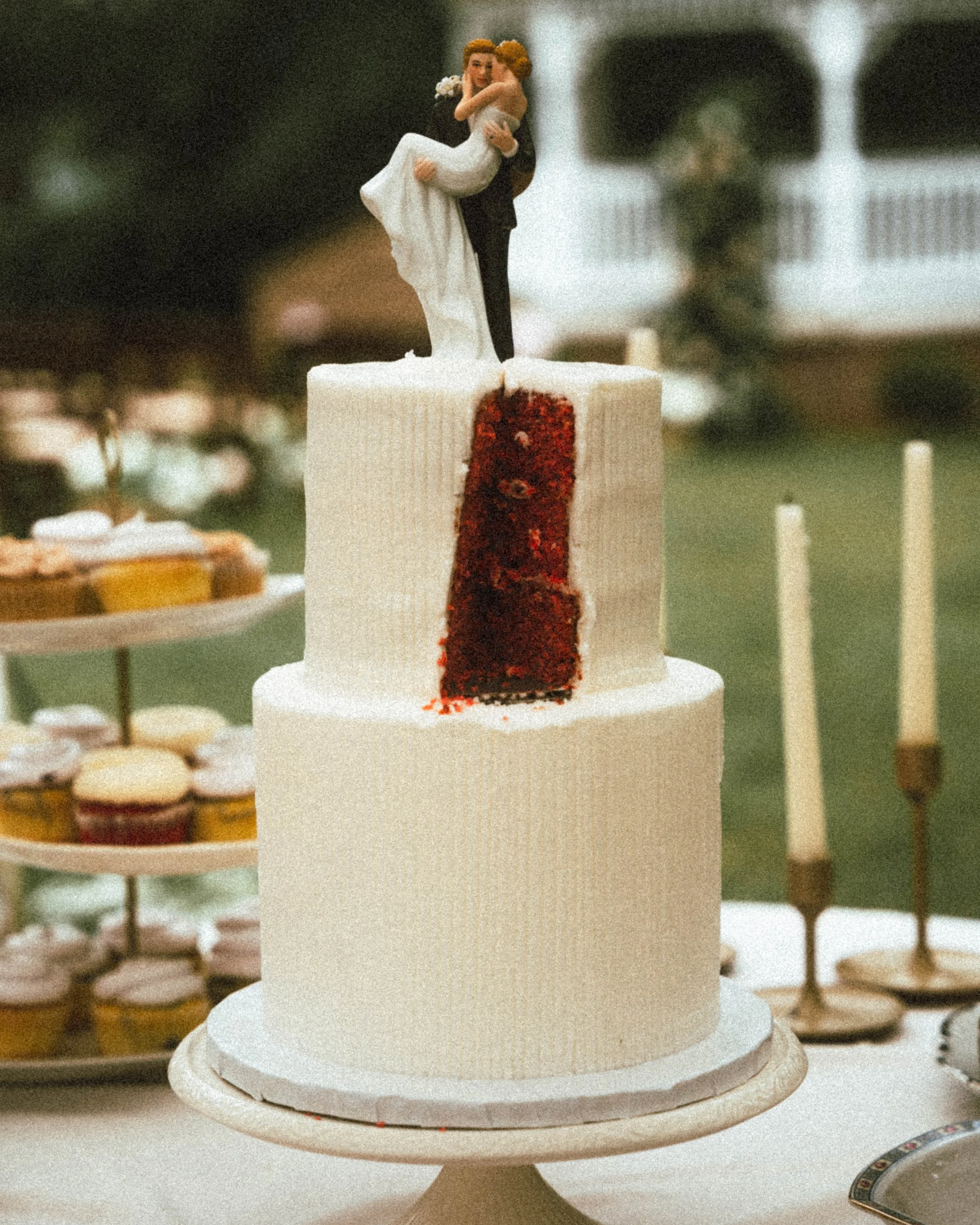 Editorial wedding photography of a red wedding cake from a southern California wedding