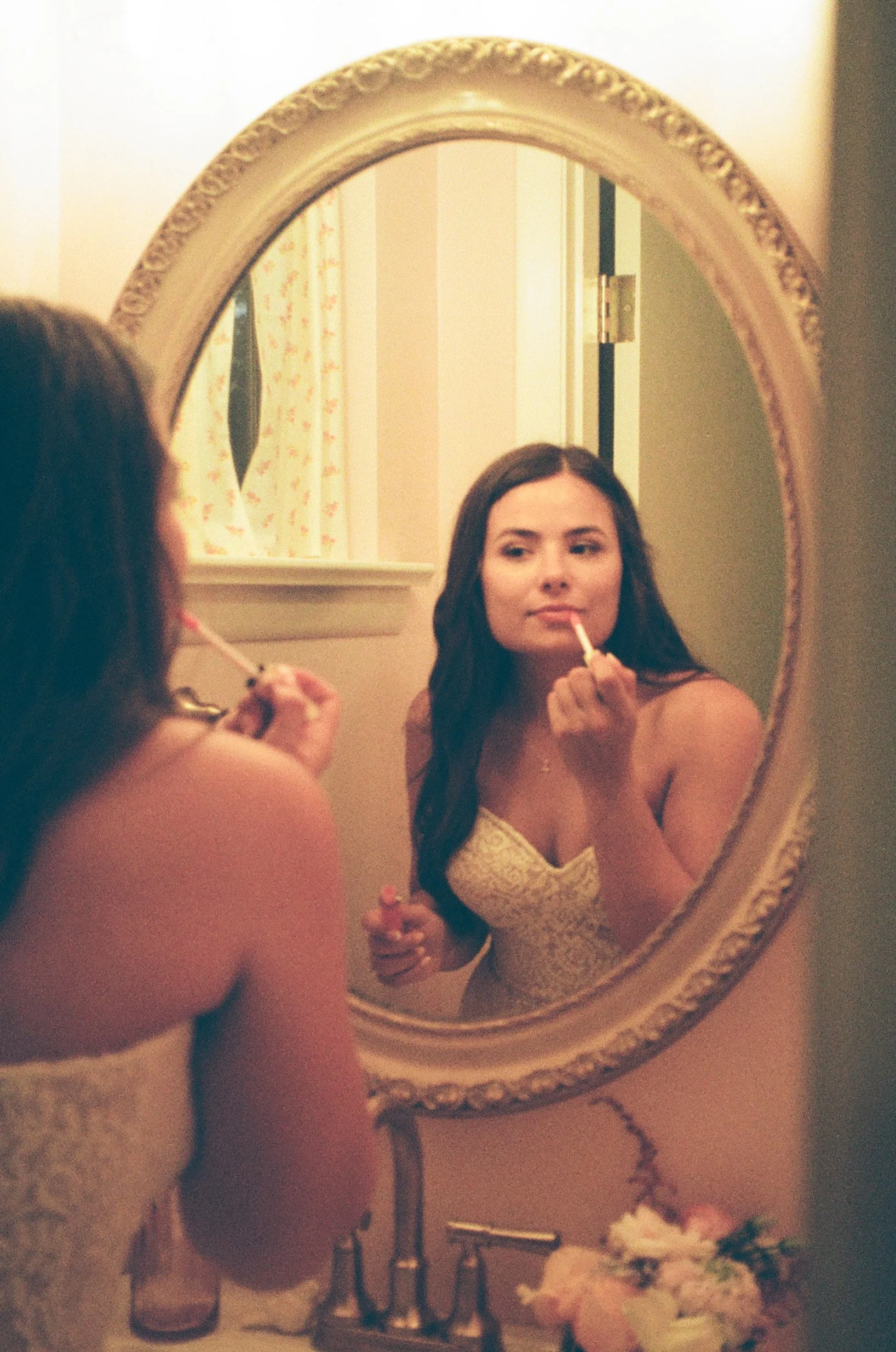 35mm Film wedding photograph of a bride applying lipgloss from a southern California wedding 
