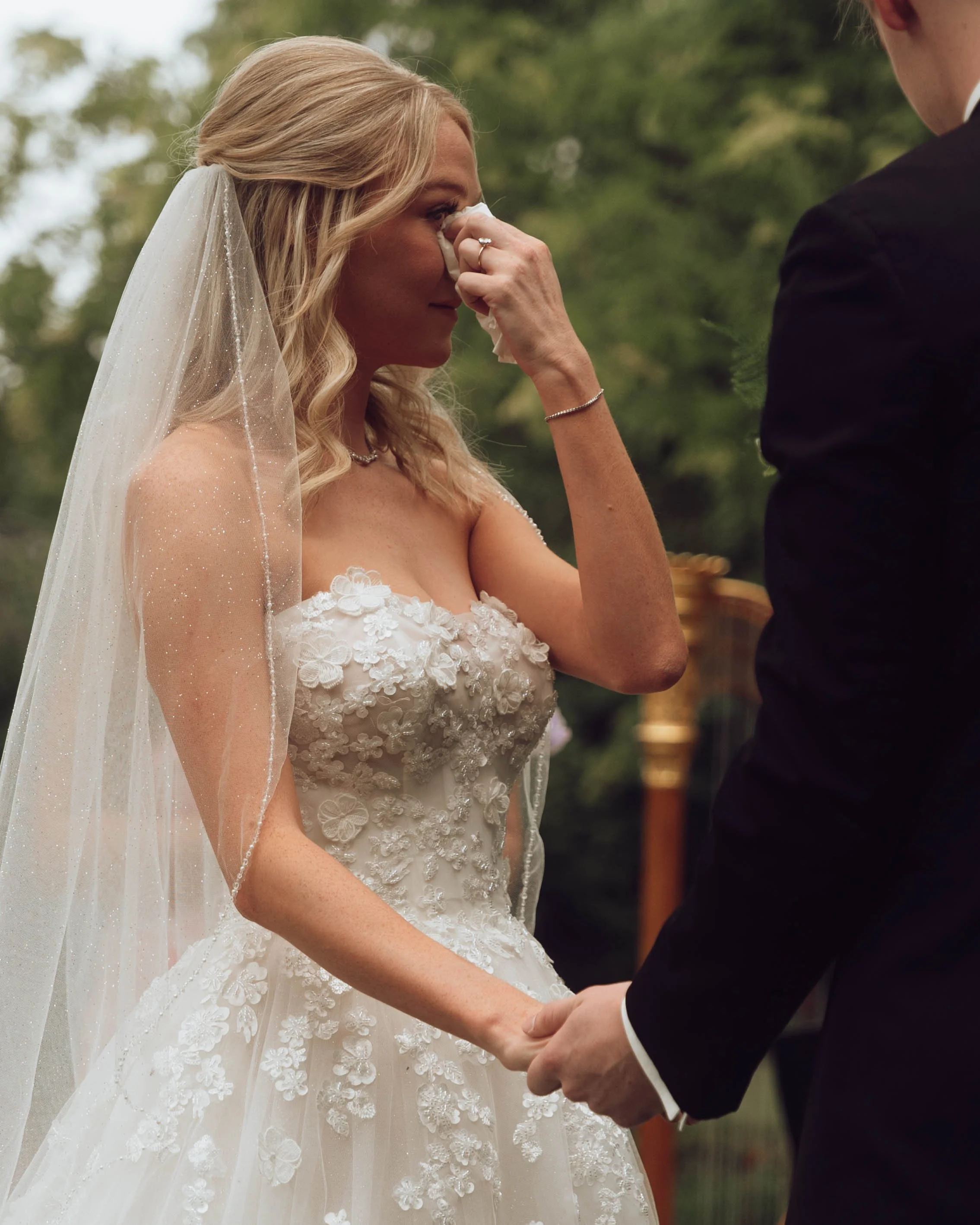Documentary wedding photograph of a bride crying during her wedding ceremony at a southern California wedding
