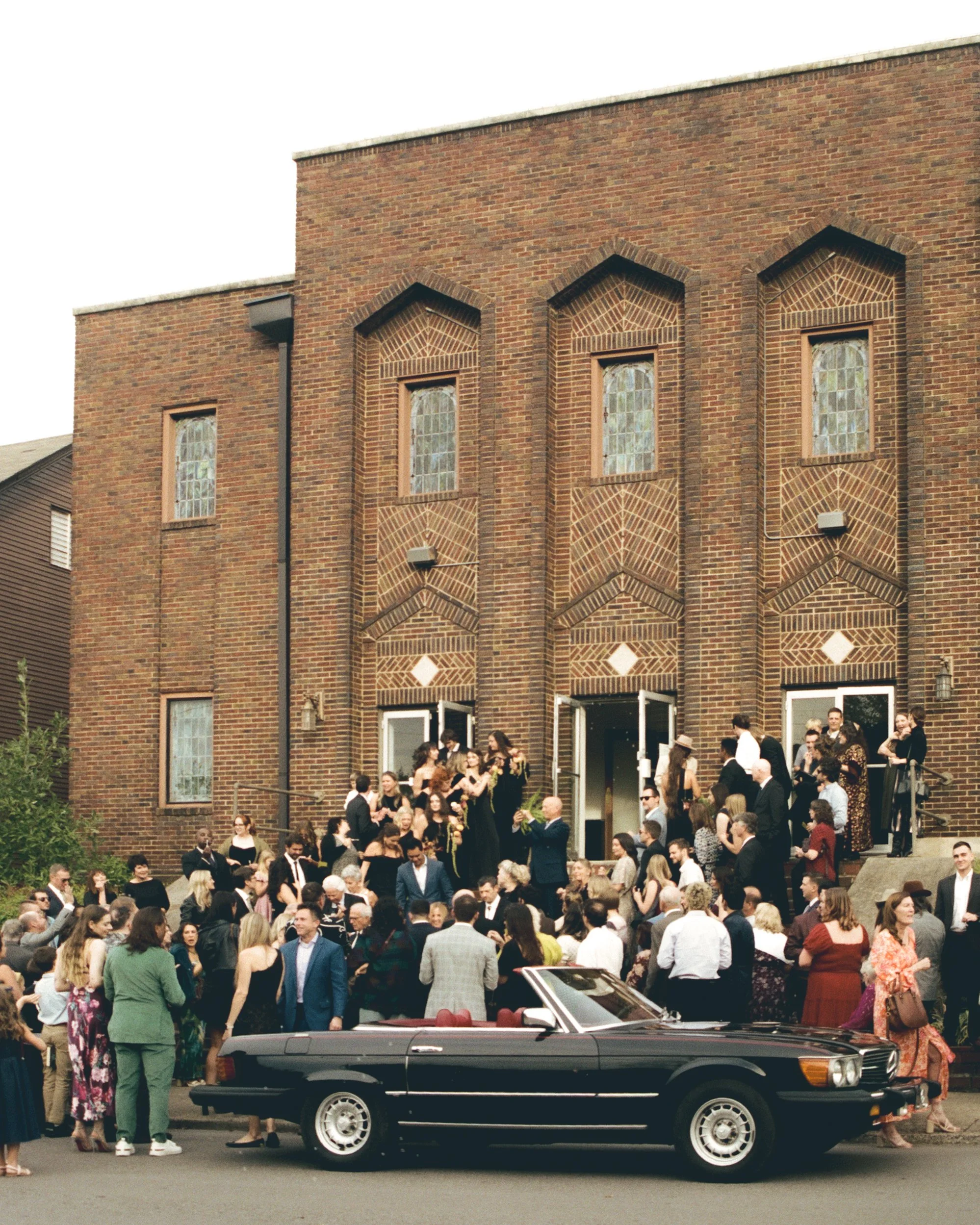 Documentary wedding photograph of guests lined up for a couples exit at a California wedding