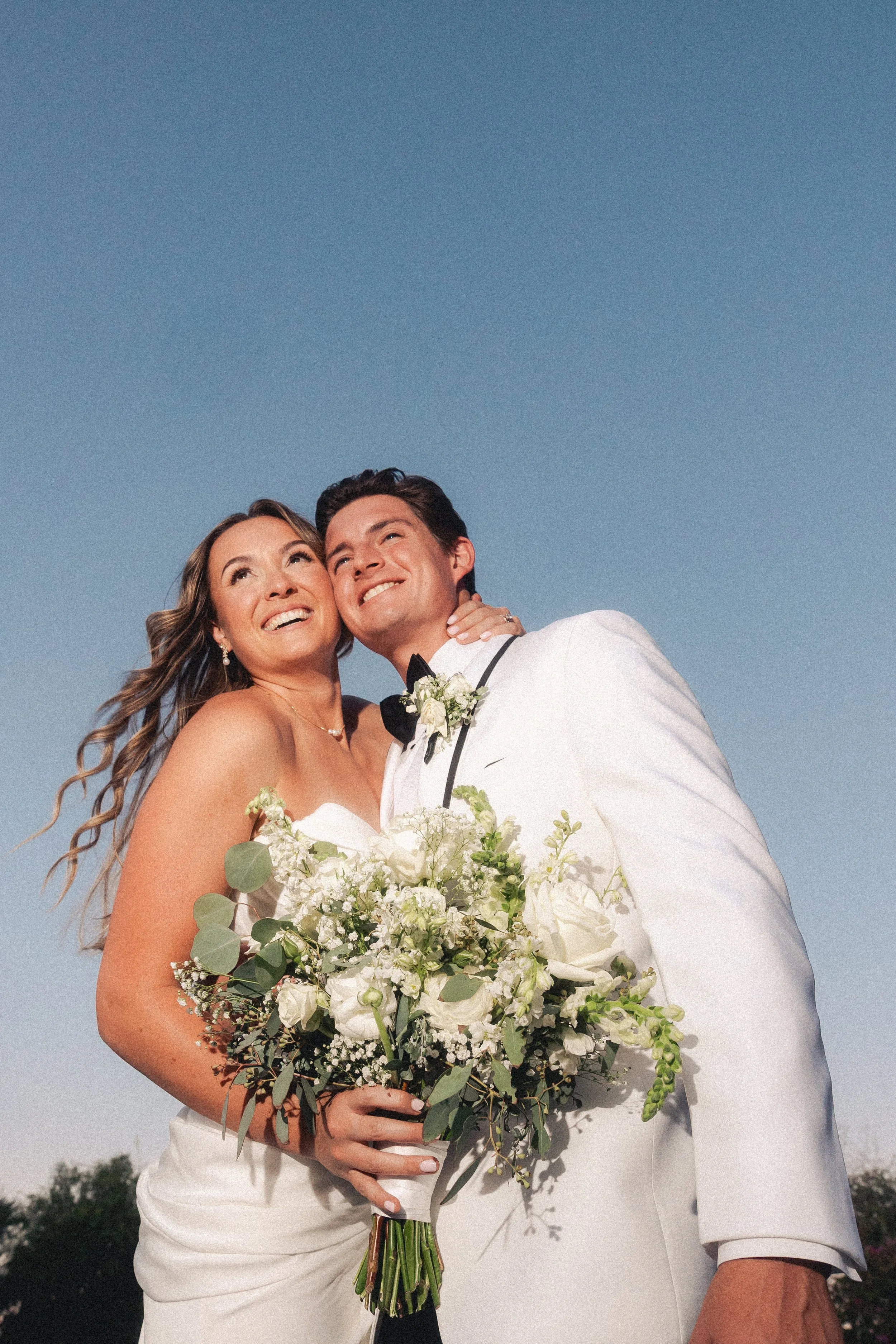 Editorial wedding photograph of a couple embracing from a southern California wedding
