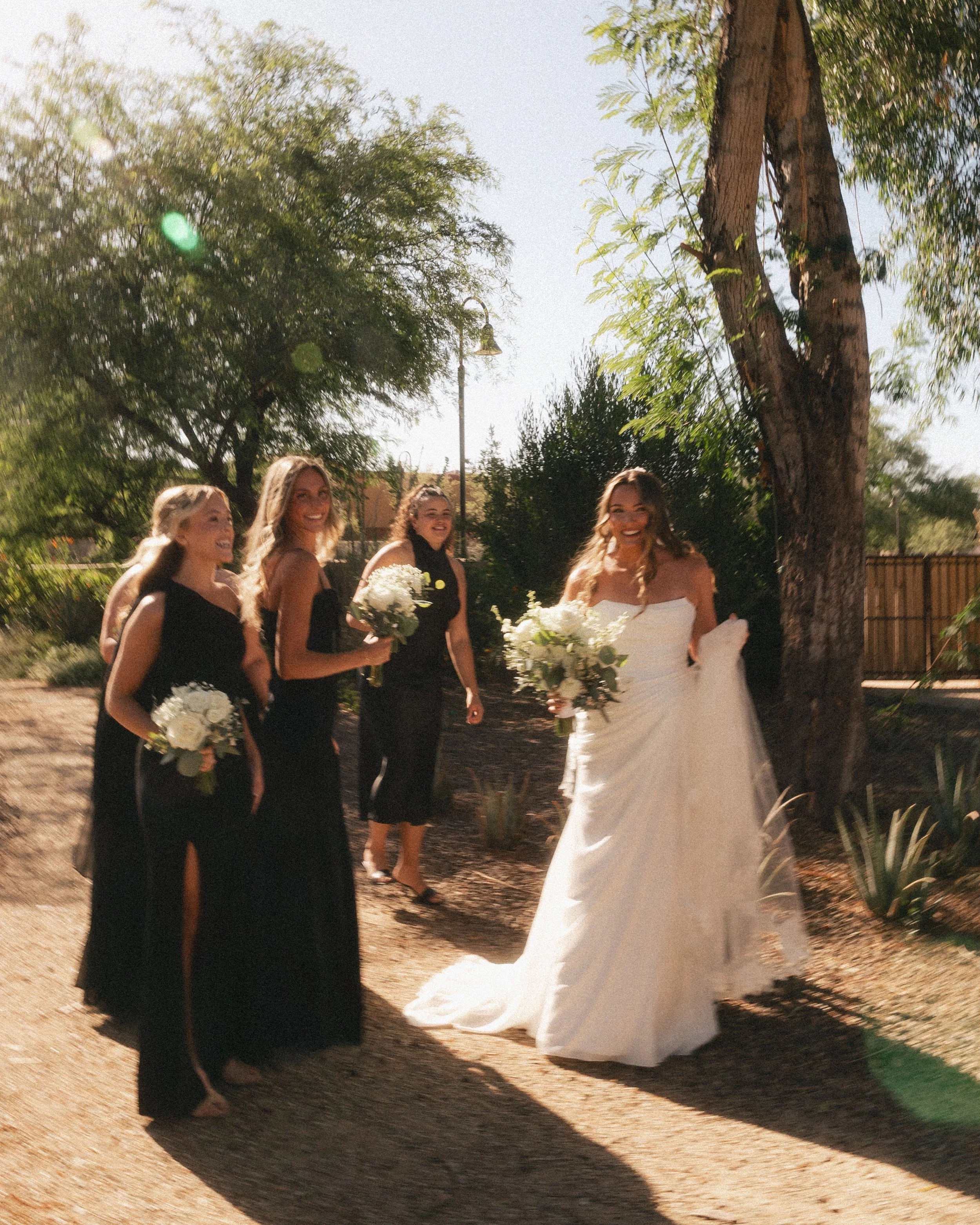 Documentary wedding photograph of a bride and her bridesmaids from a southern California wedding