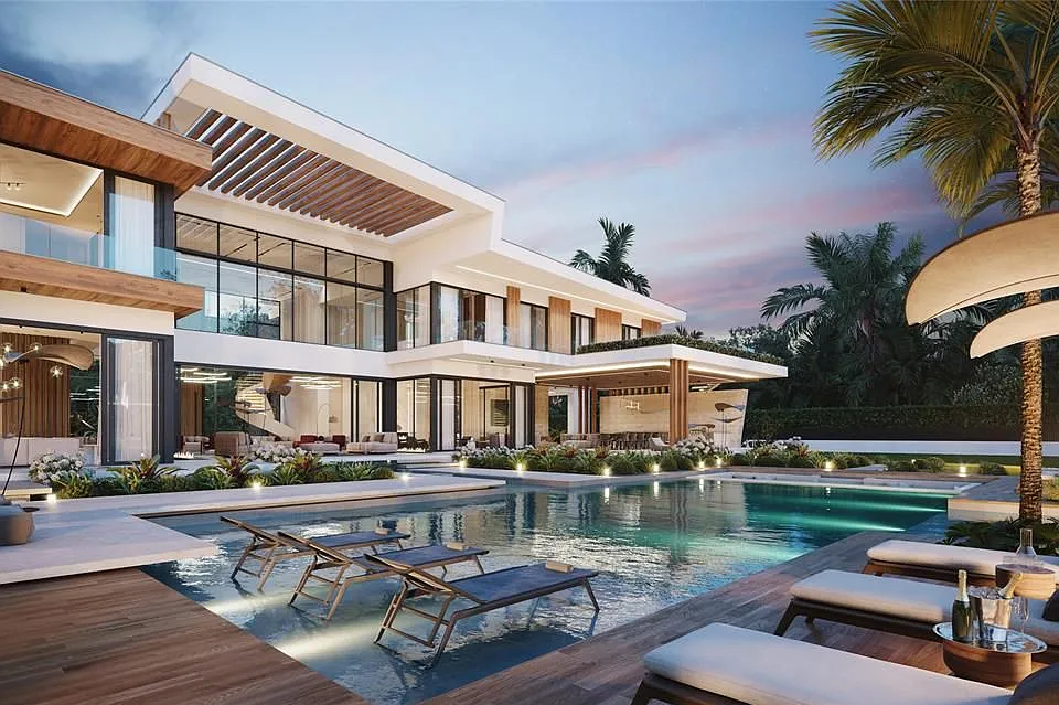 Modern luxury house with pool, outdoor lounging area, and palm trees at dusk.