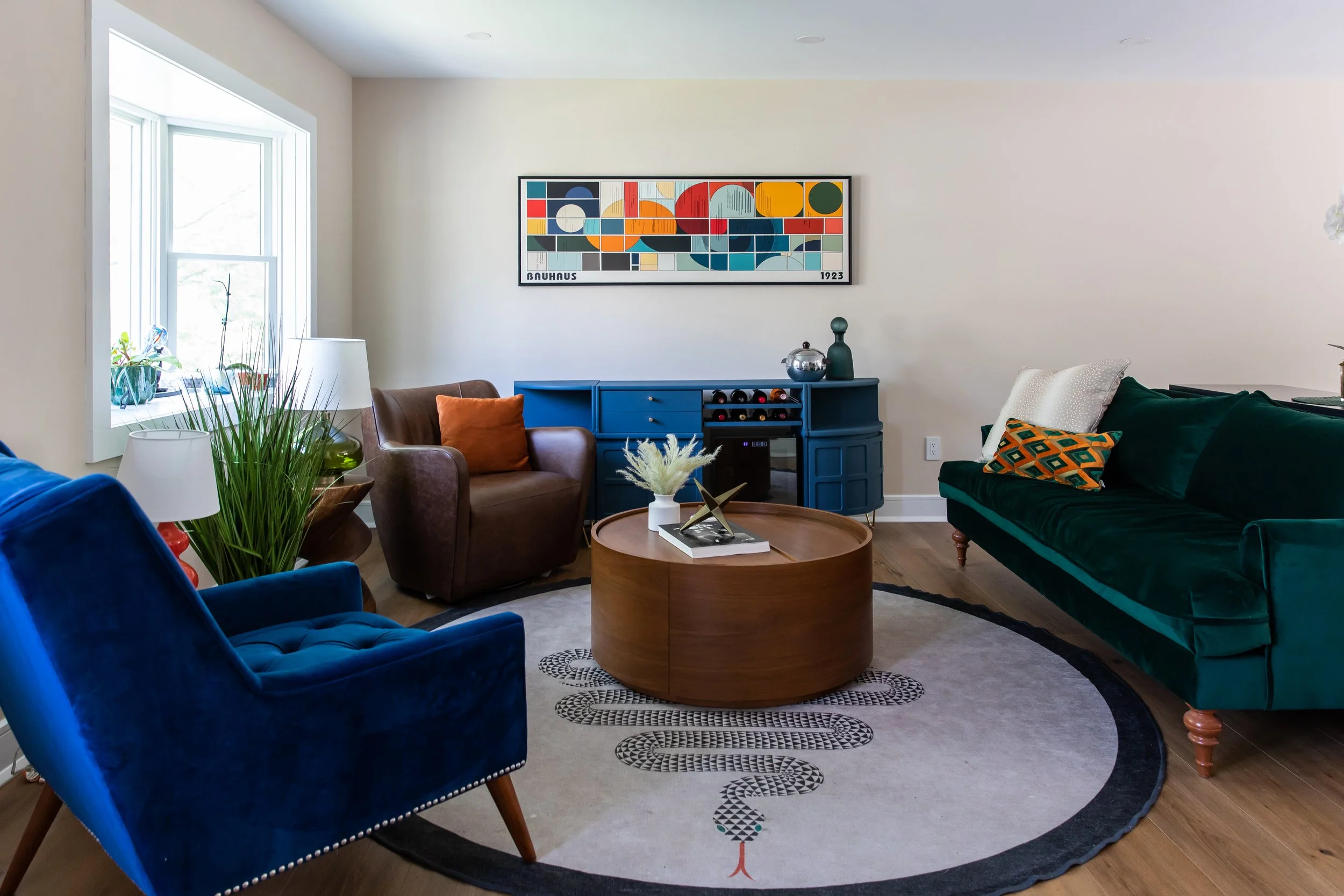 Colorful seating area with velvet sofa and mid-century furniture in a Montclair New Jersey living room.