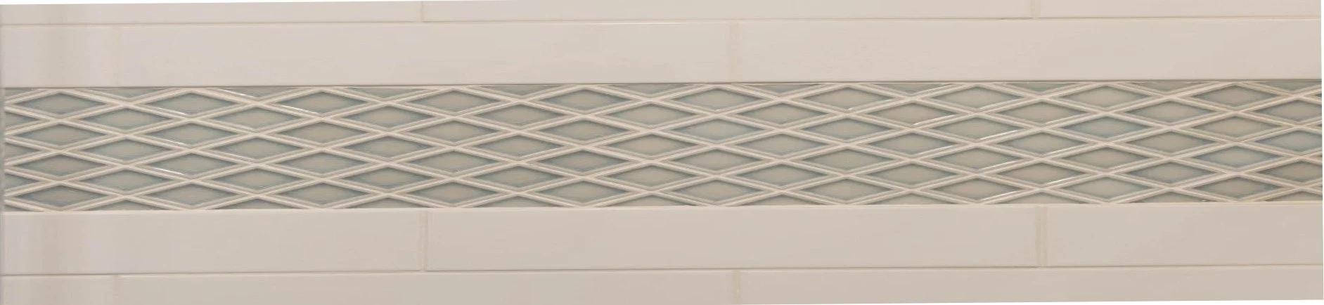 Close-up of blue diamond pattern backsplash tile with white grout detail in a kitchen designed by Caroline by Design.