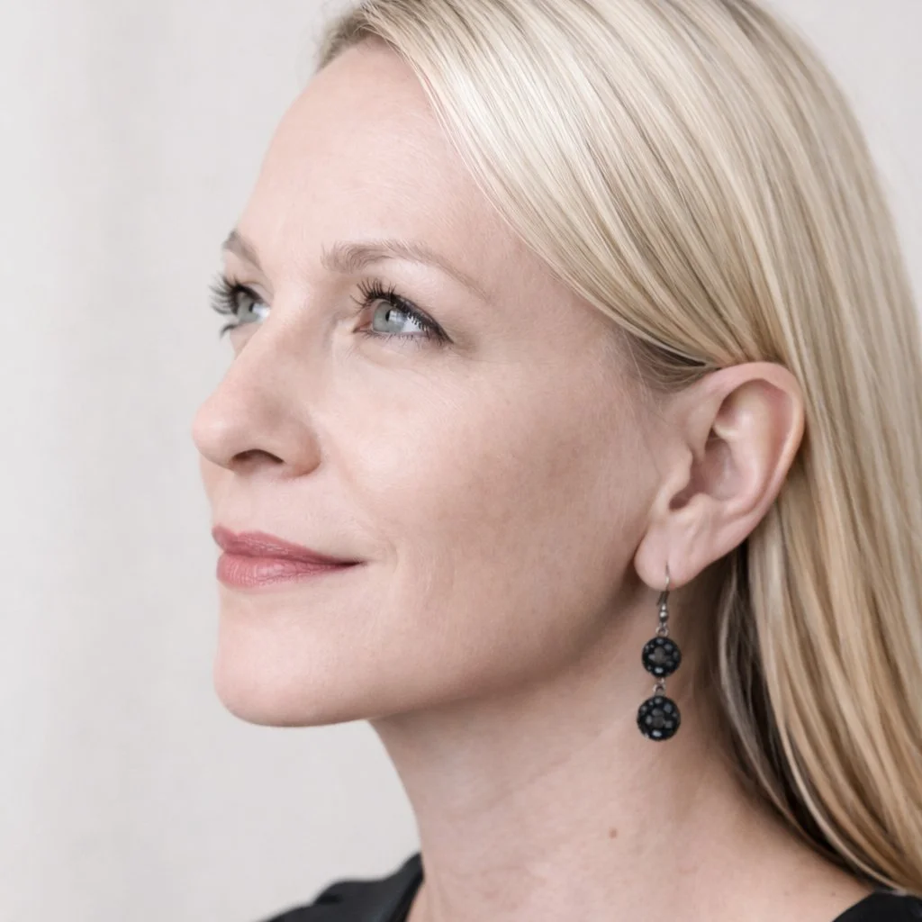 Close-up headshot of Caroline, interior designer and founder of Caroline By Design in Montclair NJ.