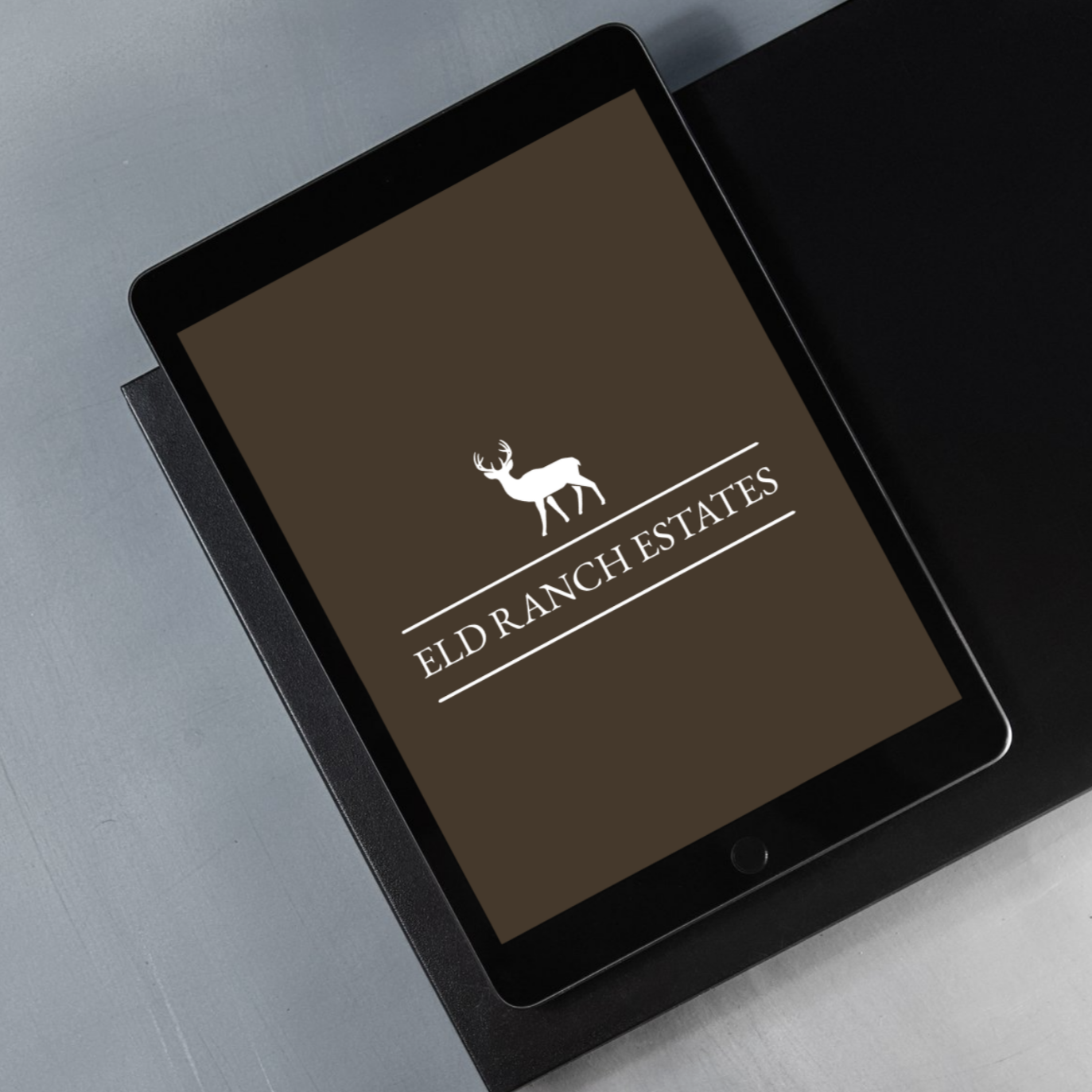 Tablet with blank screen and stylus on a wooden table.