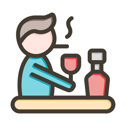 Person sitting at a bar with a glass of red wine and a bottle of wine.