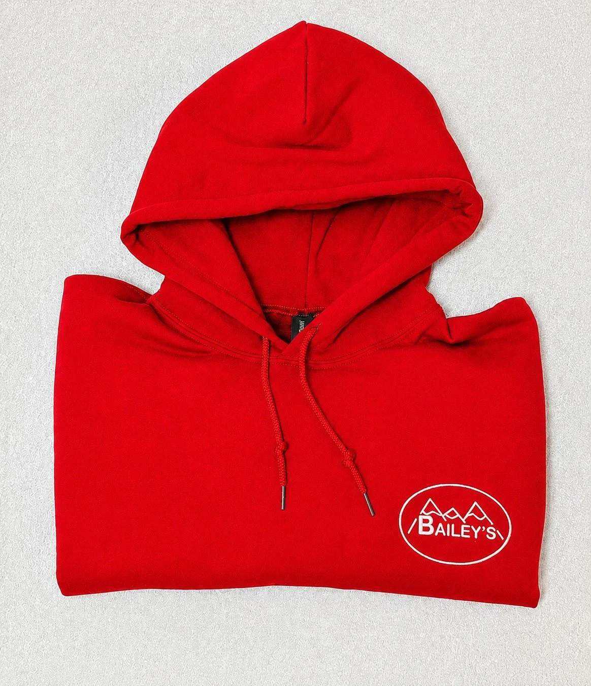 cherry red baileys hoodie folded.jpeg