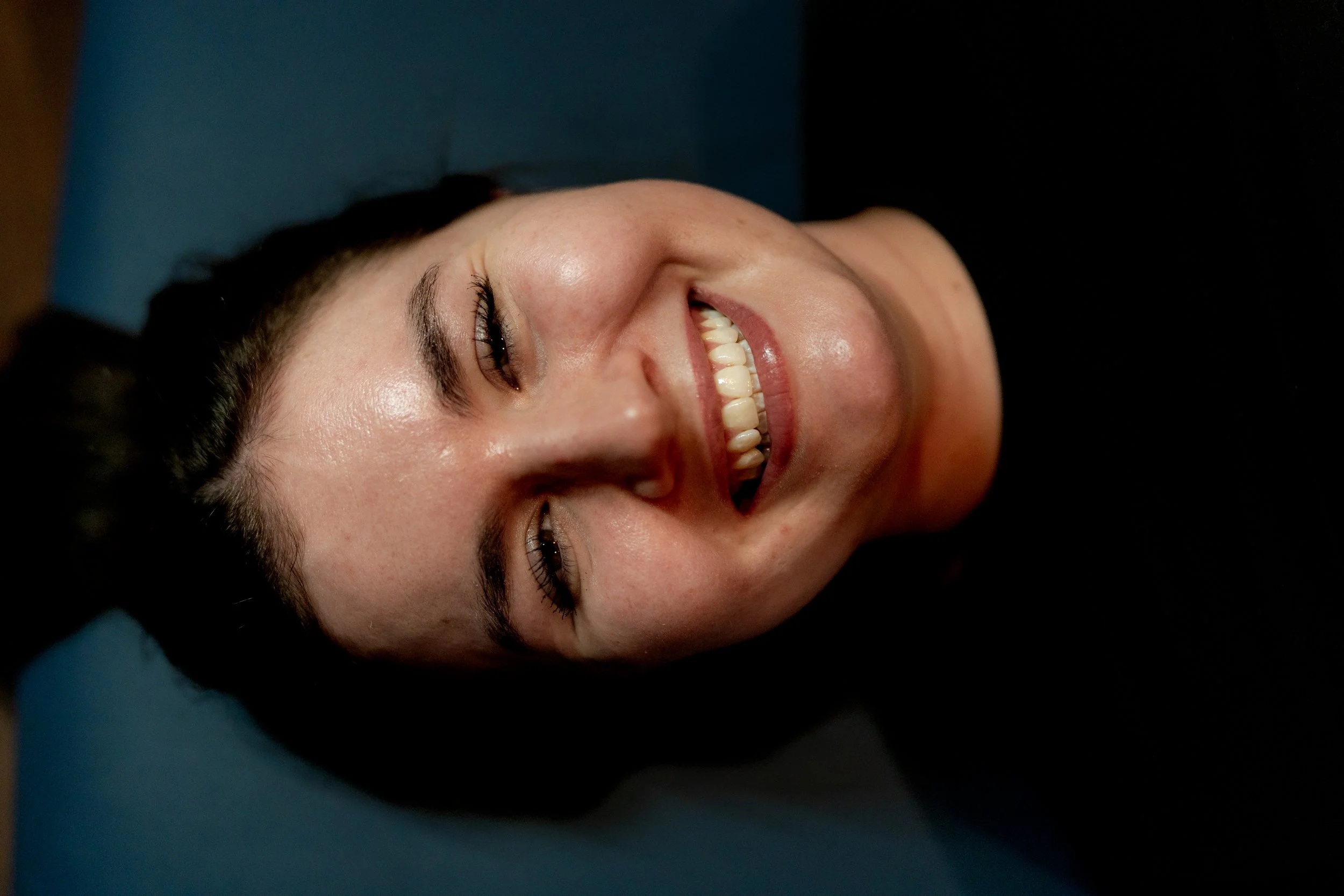 Photo of happy client during tattoo session