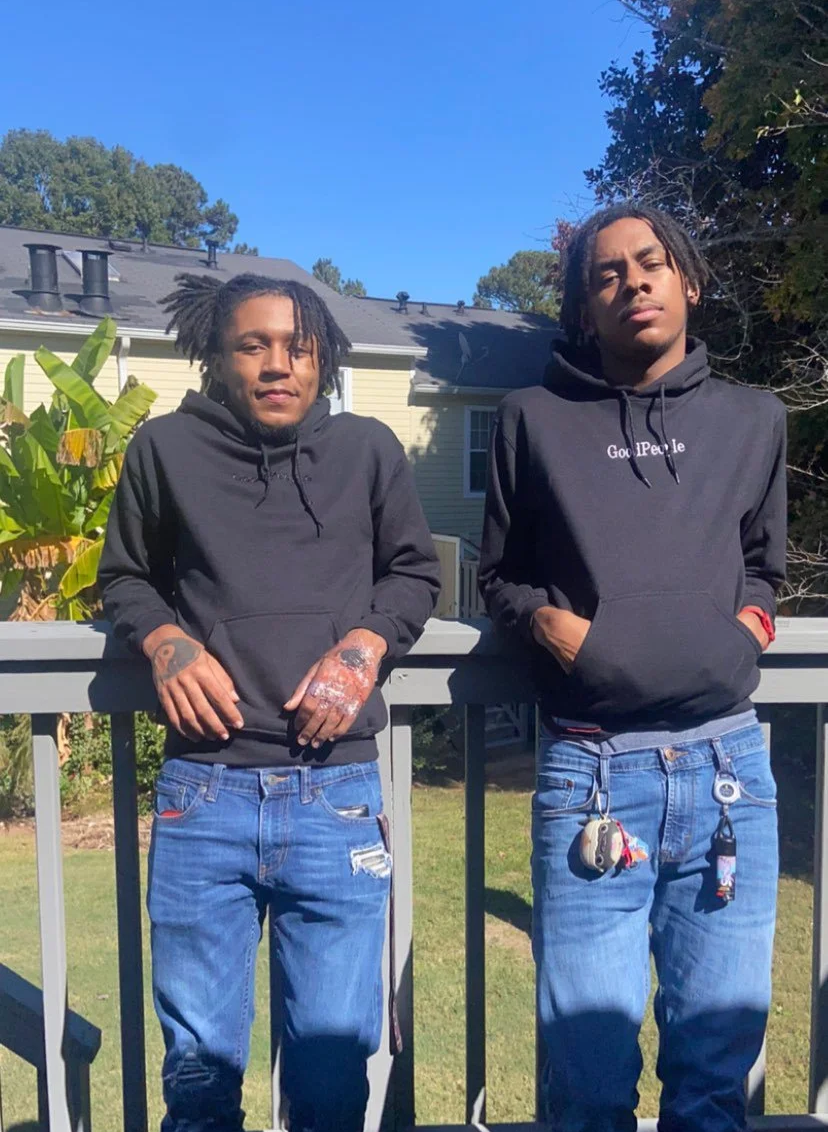 Clients wearing black Good People hoodies