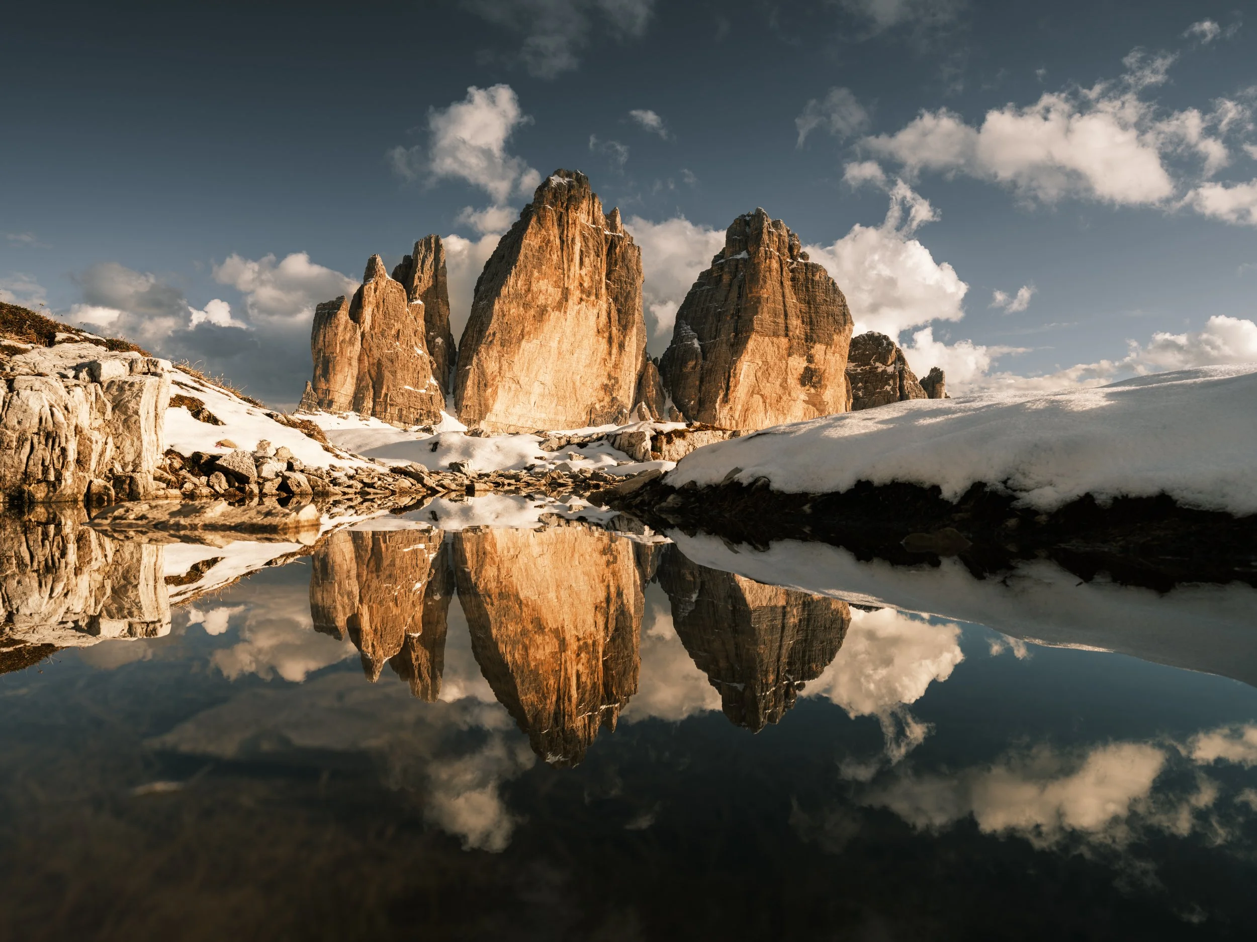 Tre Cime di Lavaredo reflecting in the pond.