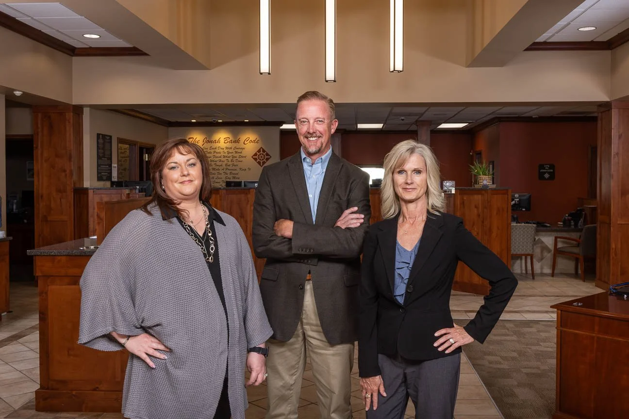 Corporate group portrait for marketing use. Group portrait created on location at a bank.