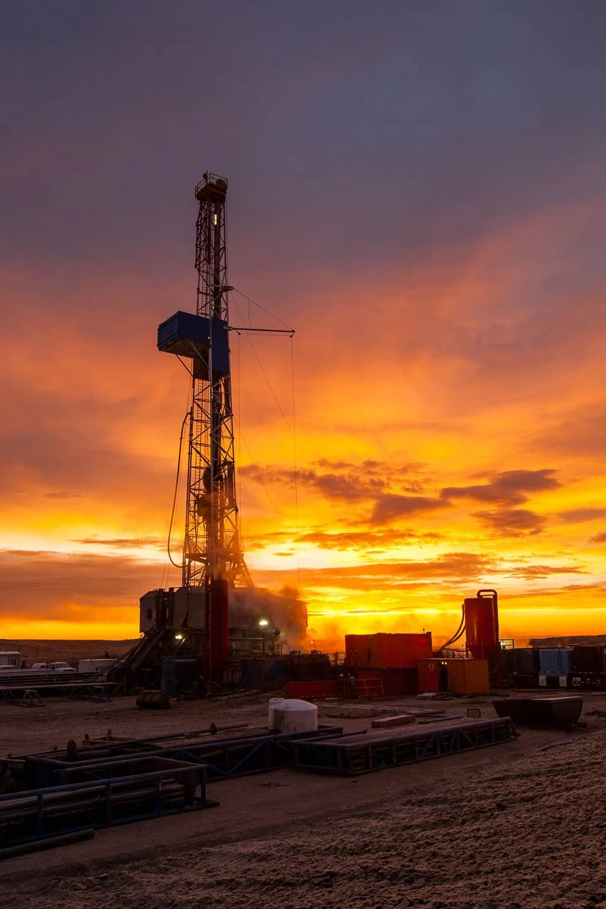 Oil and gas industry photography for marketing, including an oil and gas drilling rig at sunrise.