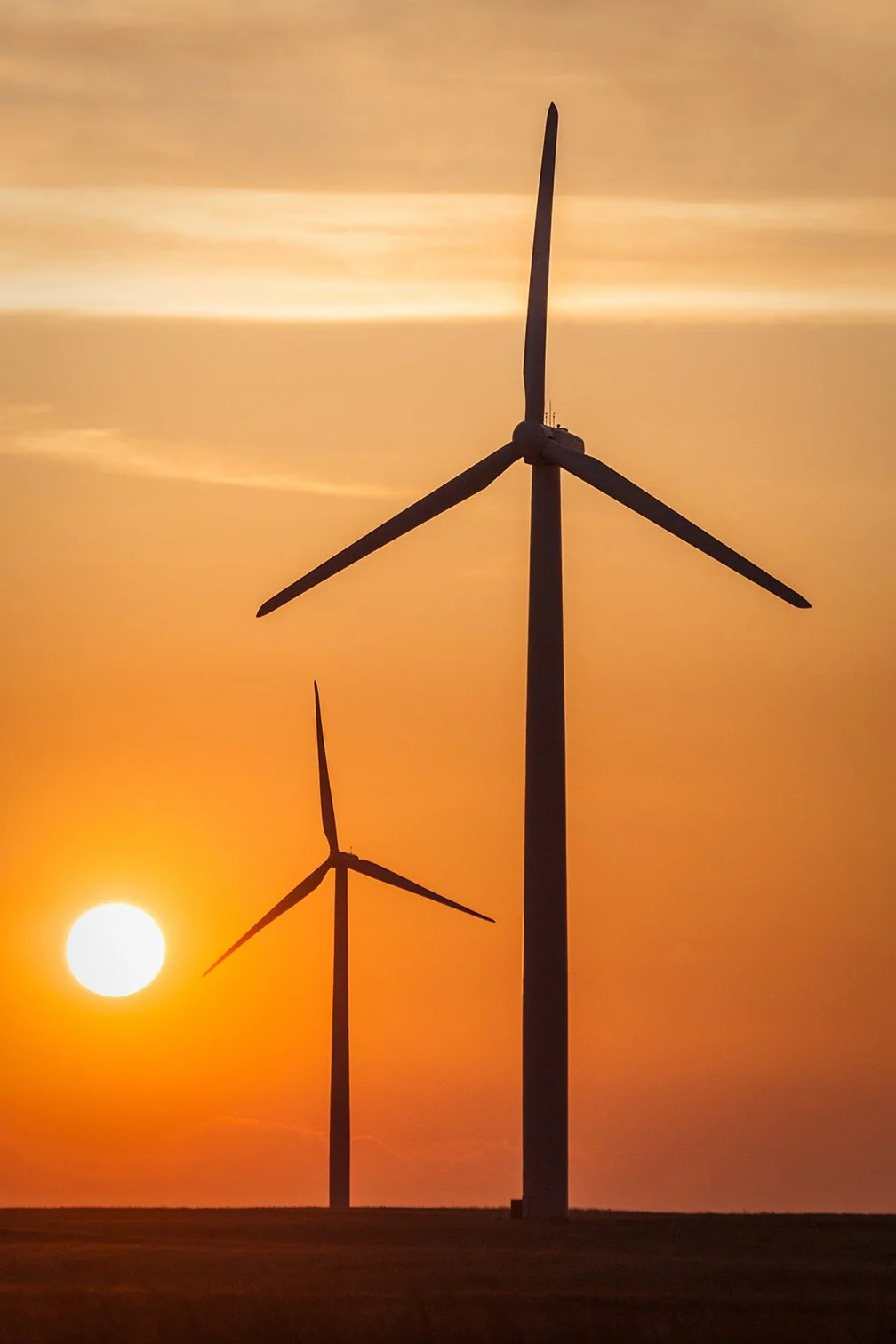 Sun setting on a wind farm in Northern Colorado