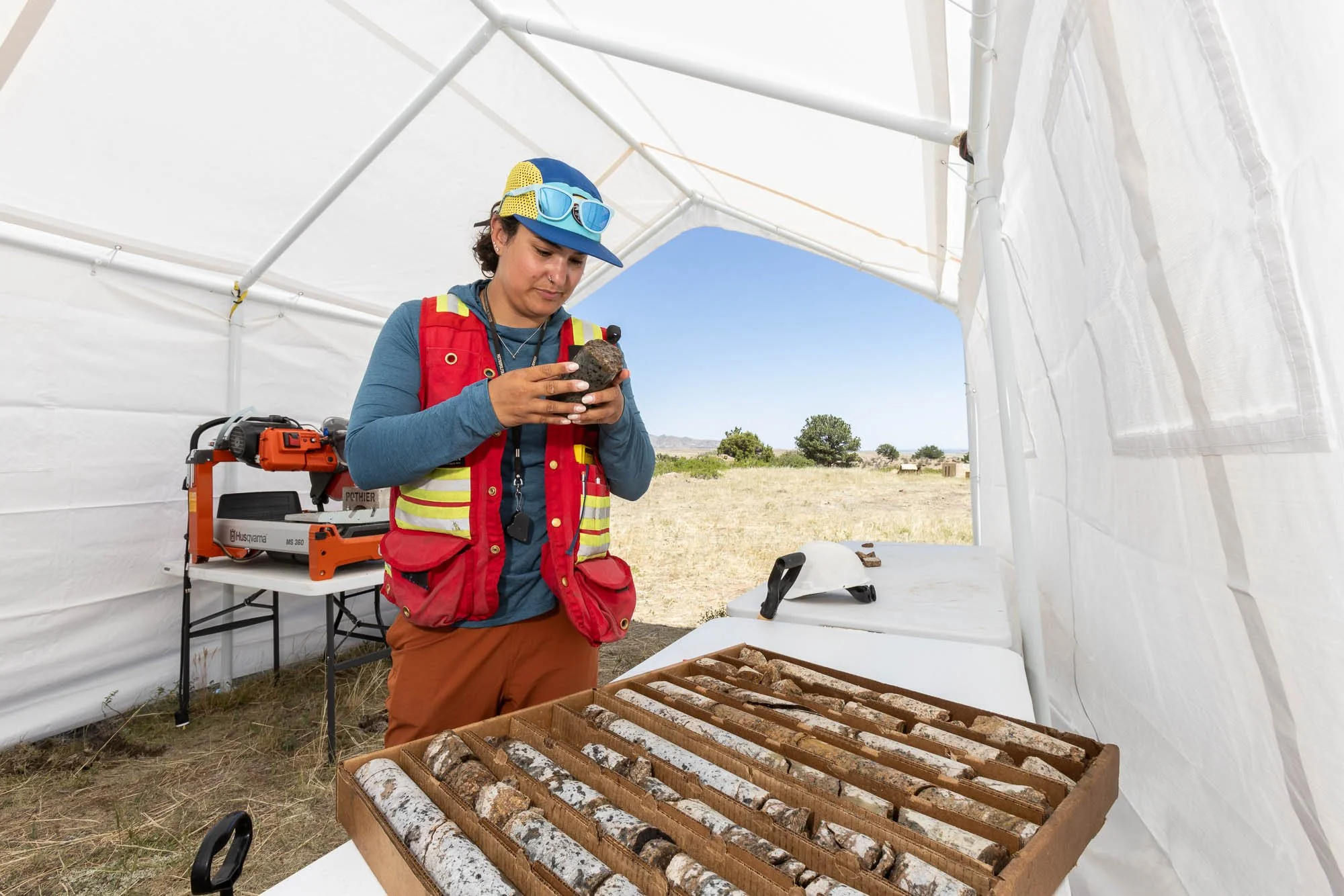 A geologist looks for mineral deposits in core samples at a Rare Earths mine in Wyoming.