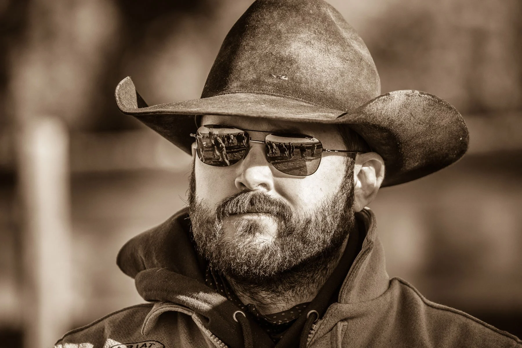 Sepia-toned portrait of a cowboy.