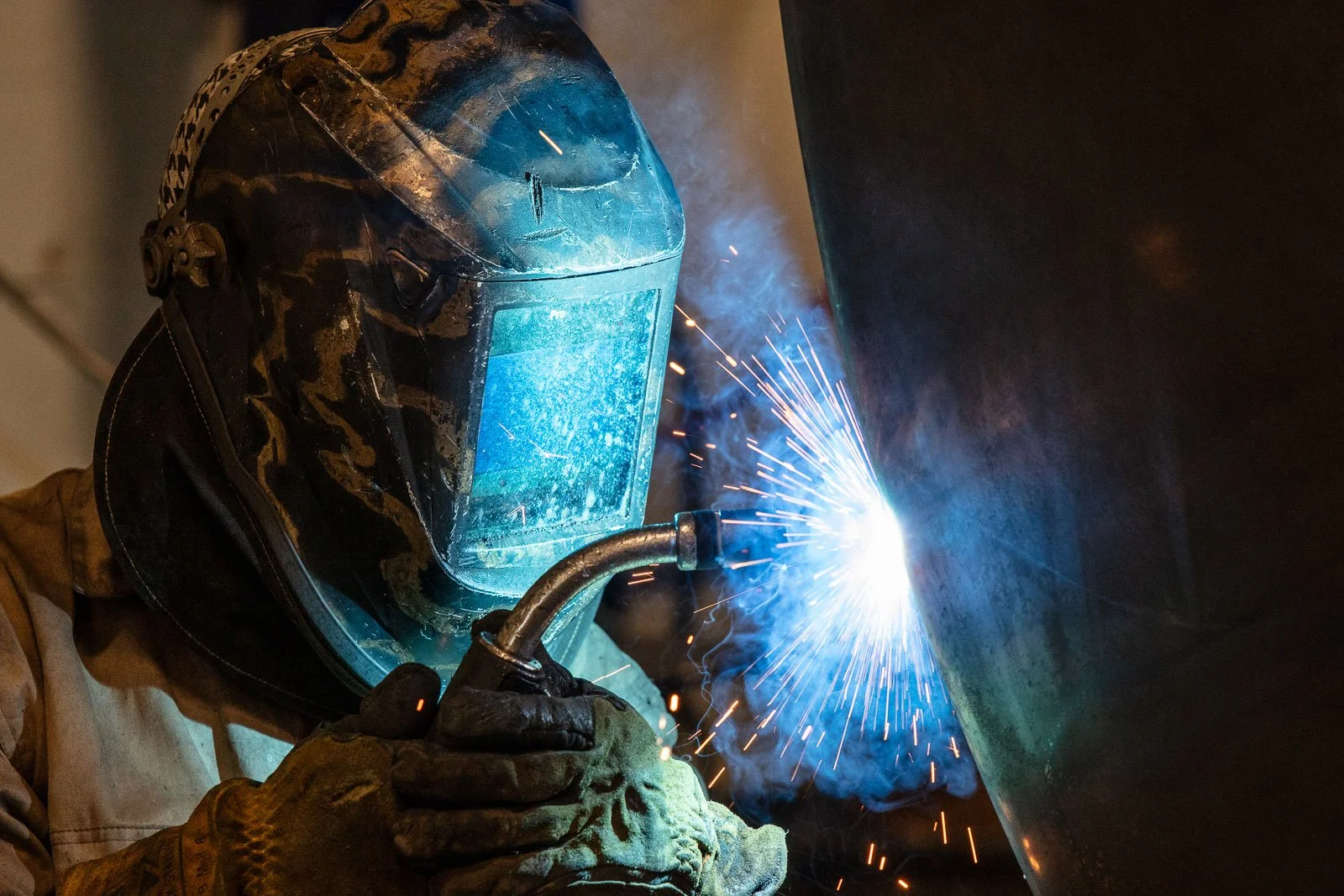 Welder working and welding at EMIT Technologies in Sheridan, Wyoming