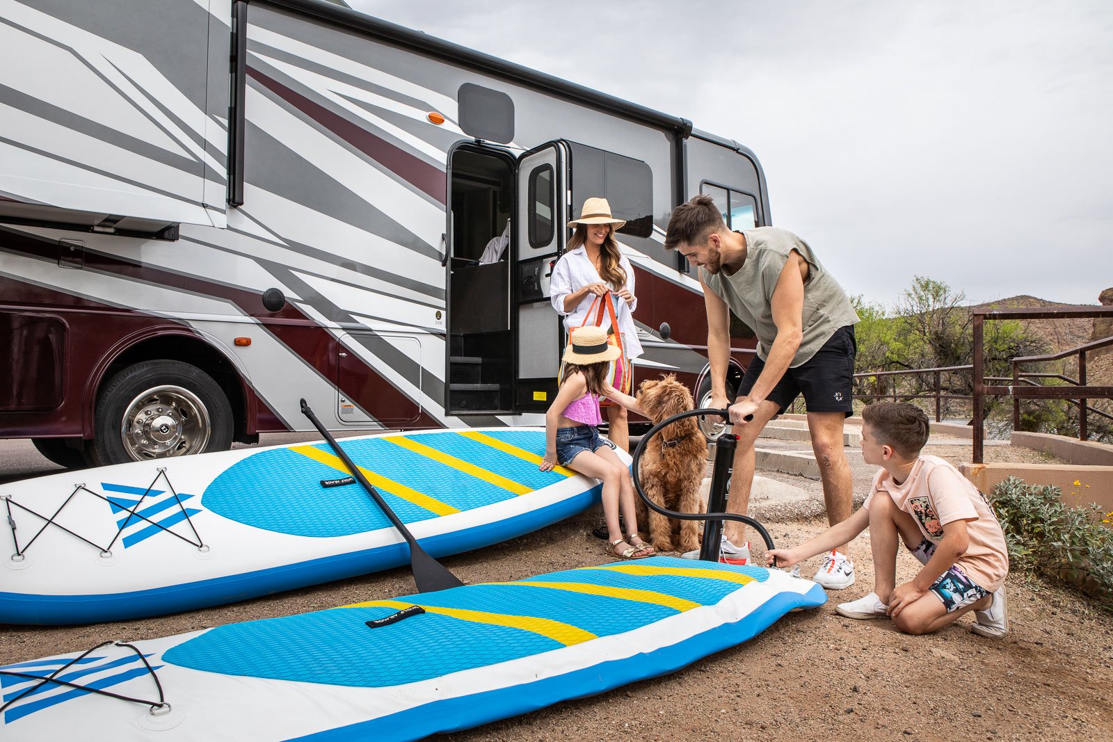 Lifestyle photography, family time at the lake during a camping trip in the 2023 Holiday Rambler Eclipse at Canyon Lake in Tonto National Forest in Arizona. Image created for Rev Group.