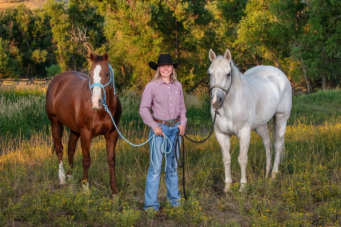 Senior portrait with cowgirl and horse at the Wyoming Hereford Ranch in Cheyenne, Wyoming.