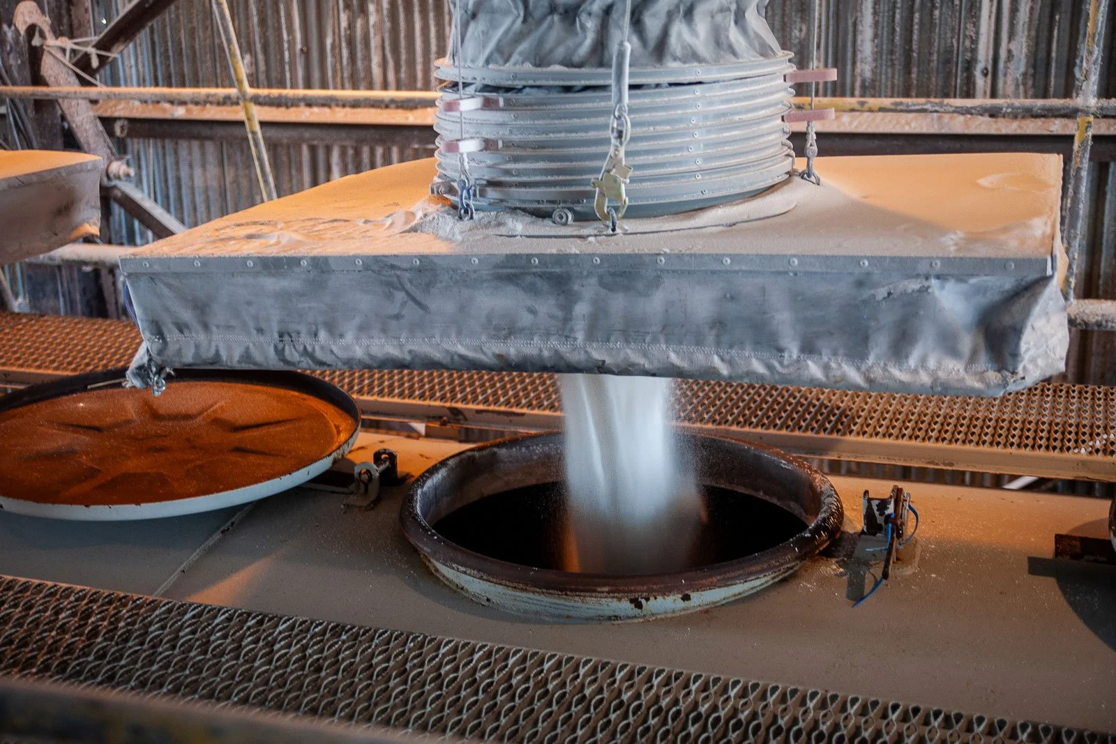 Soda ash is loaded into a train car at a Trona mine.