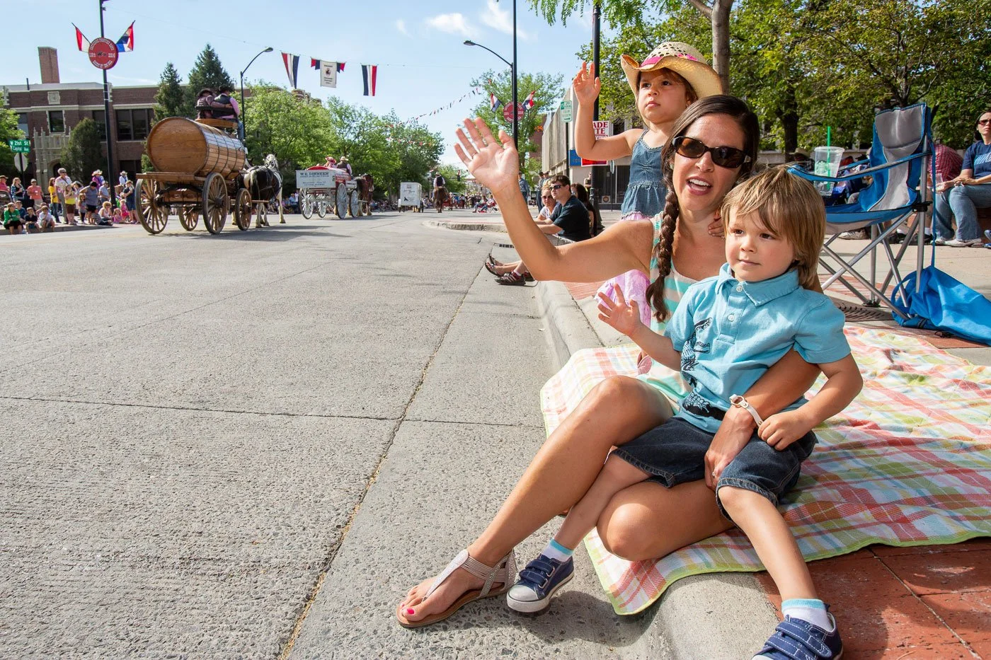 Families enjoy the Cheyenne Frontier Days Parade in Cheyenne, Wyoming.