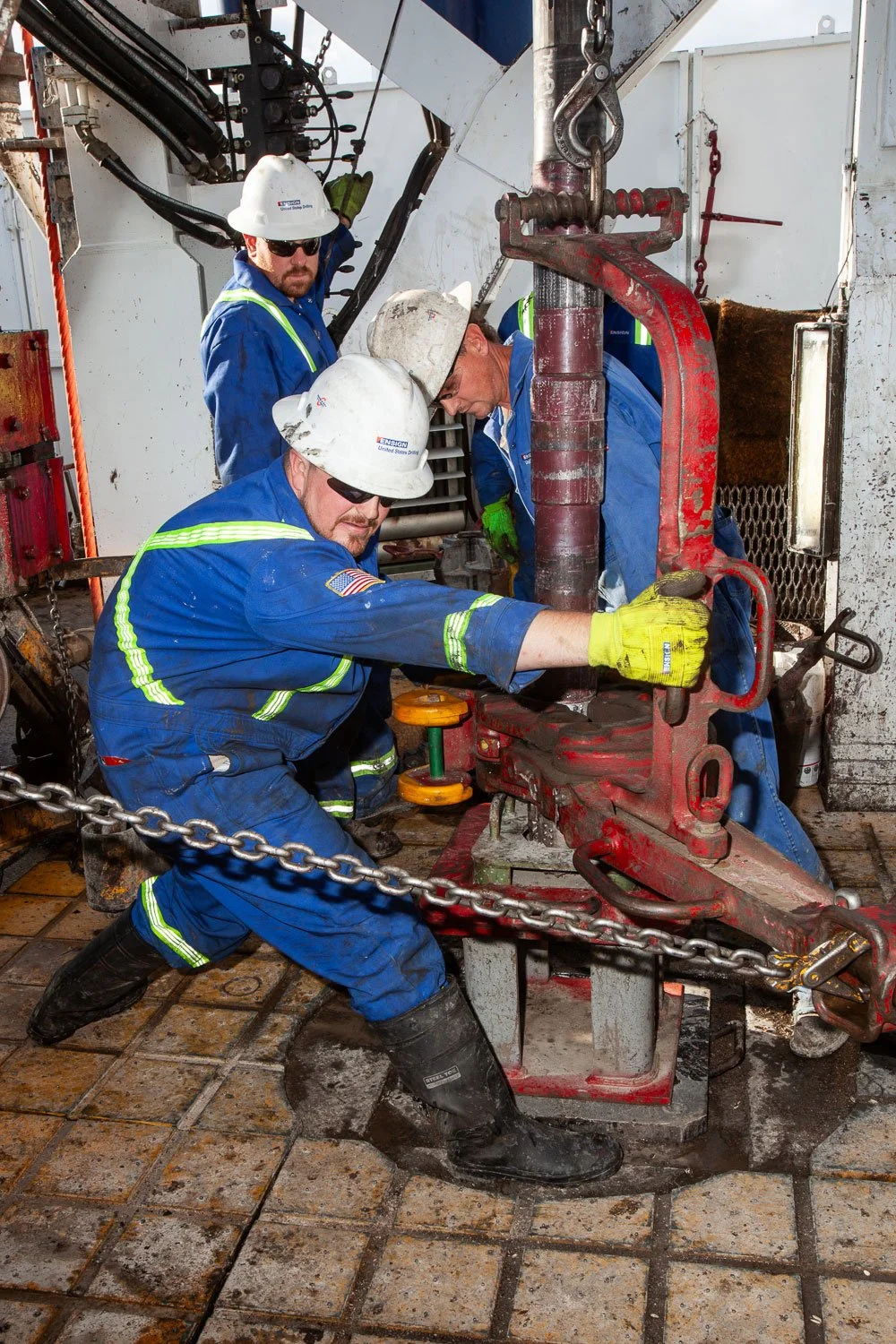 Oil field worker working on a oil and gas drilling rig.