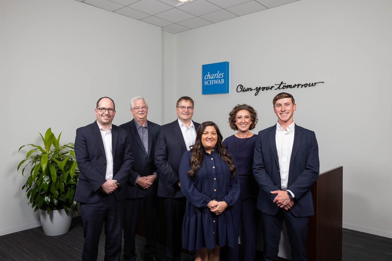 Corporate group portrait photography for Charles Schwab marketing use. Created on location at the client's office.
