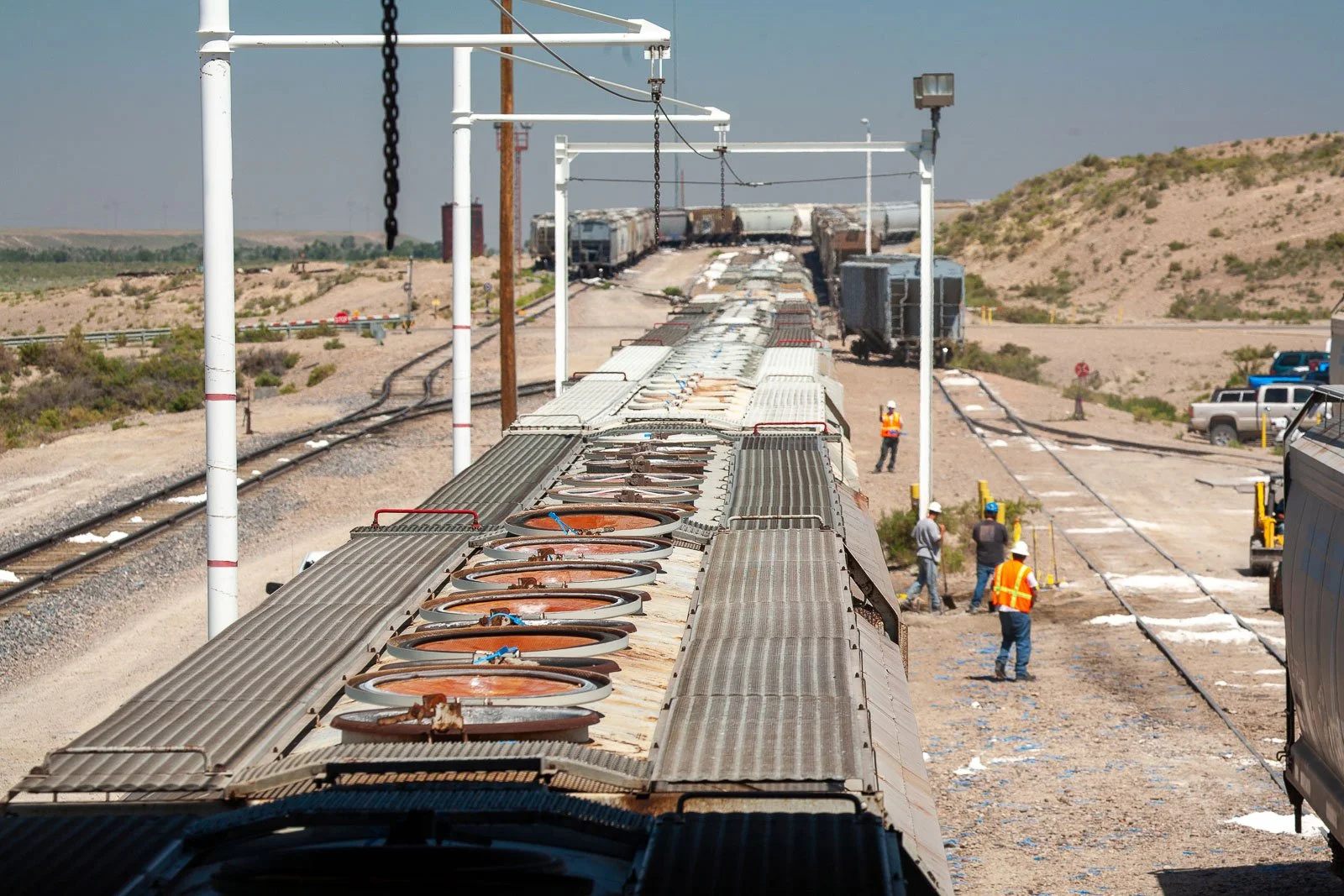 Train cars arrive to be loaded at a Trona Mine near Green River, Wyoming.